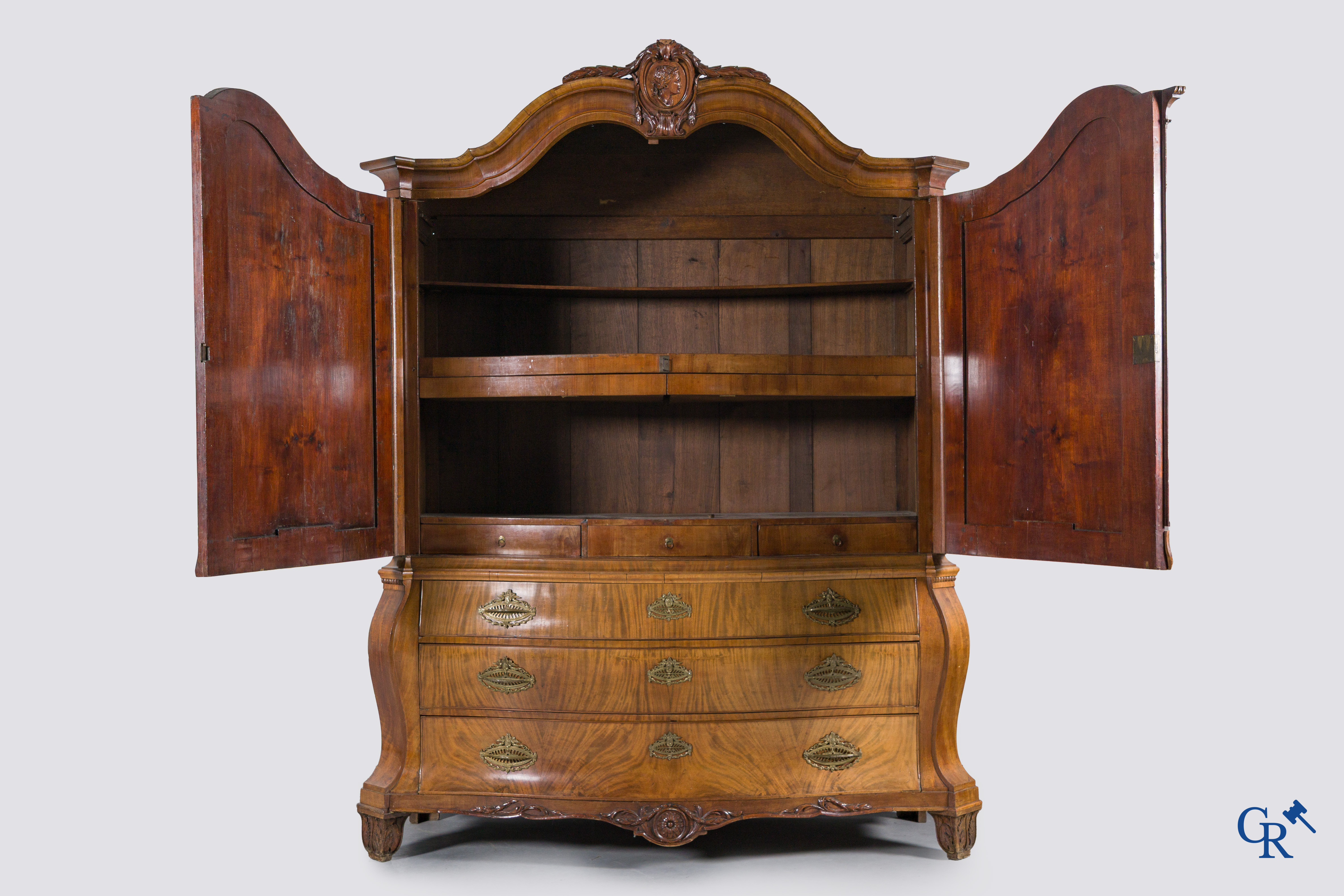 A large mahogany wooden cabinet with 3 drawers and 2 doors decorated with lockets. LXVI style.