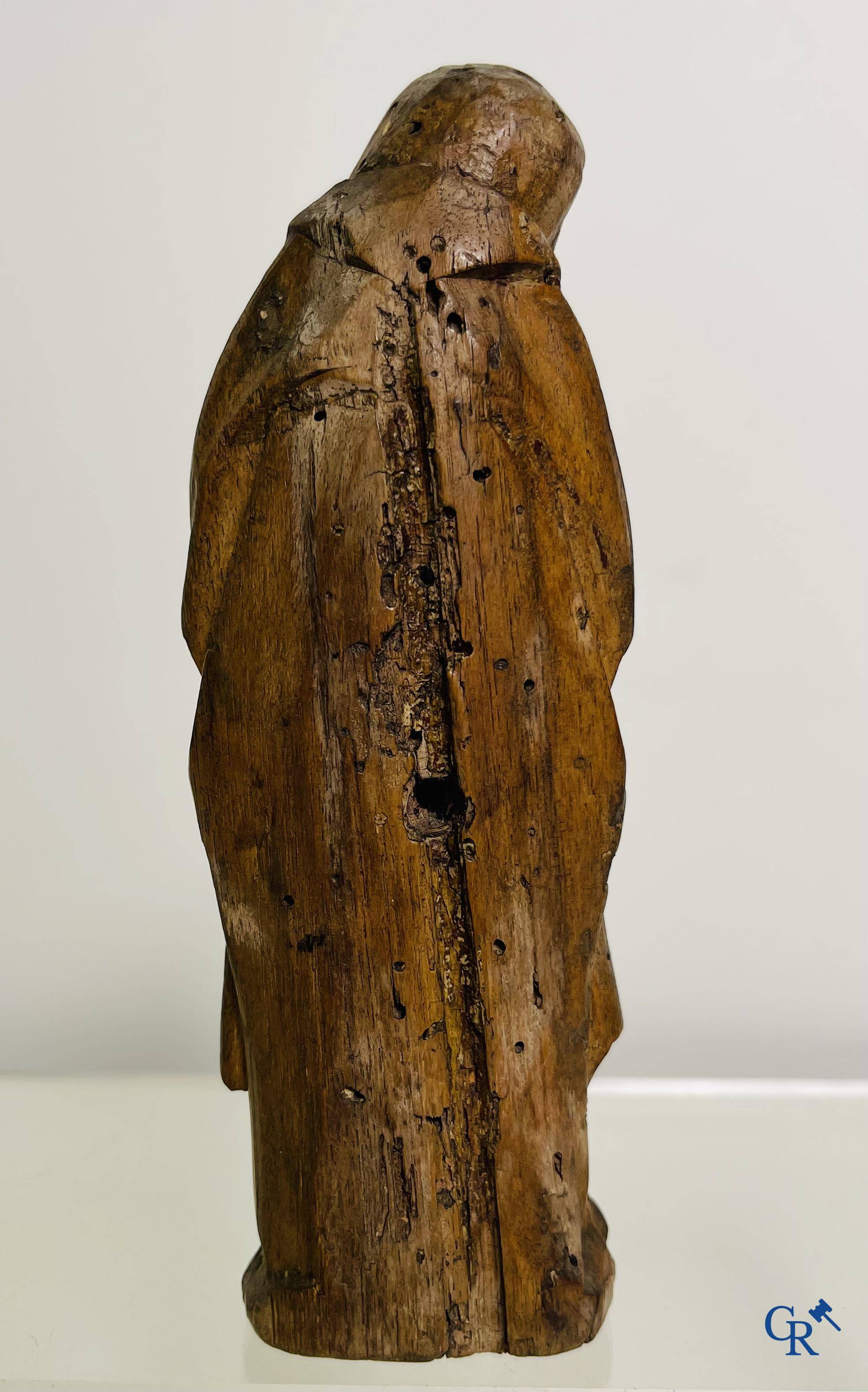 2 religious fragments in palm wood and lime wood. 16th-17th century.