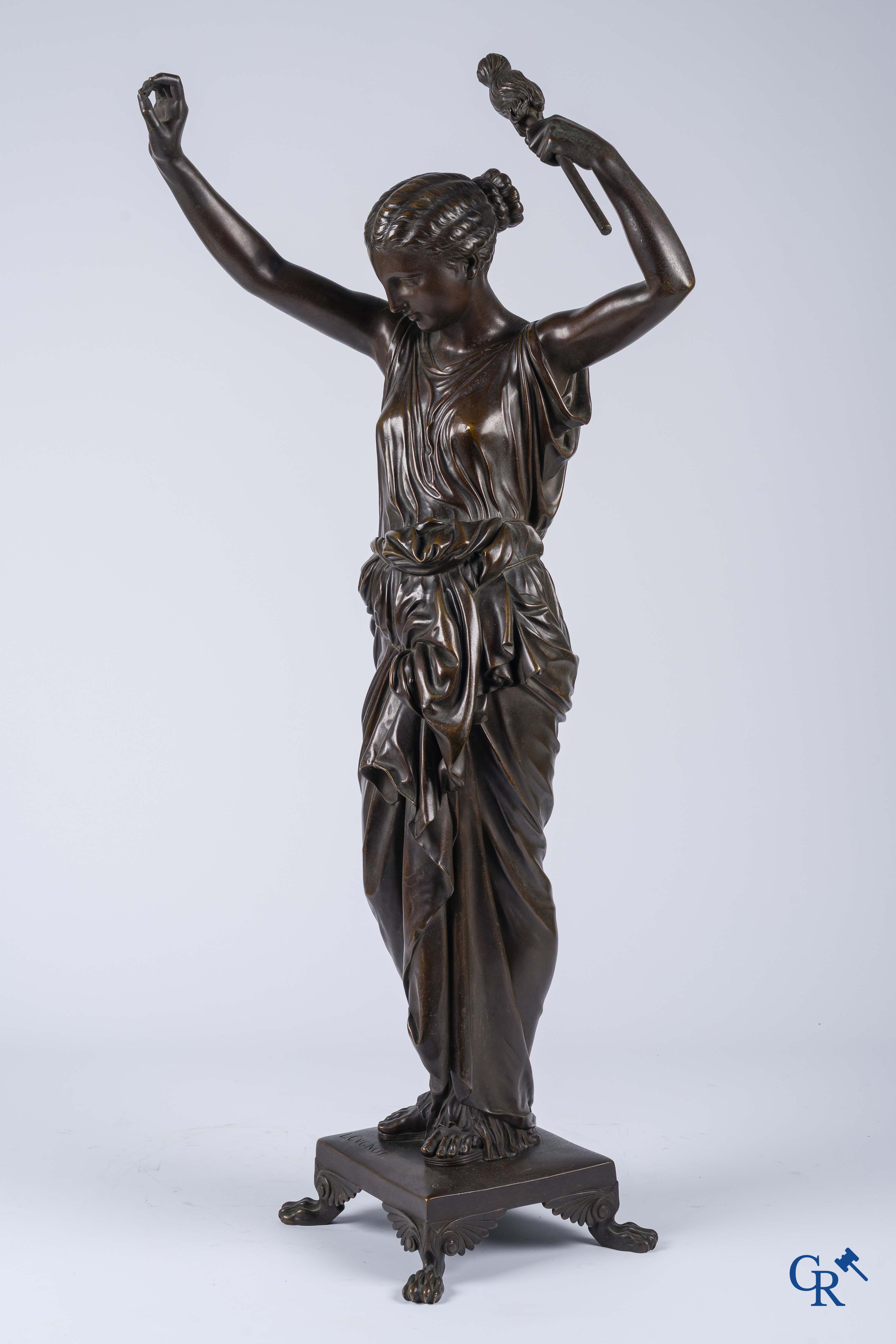 Louis Léon Cugnot (1835-1894) A large 3-piece bronze chimney set "La Fileuse" Signed L. Cugnot.