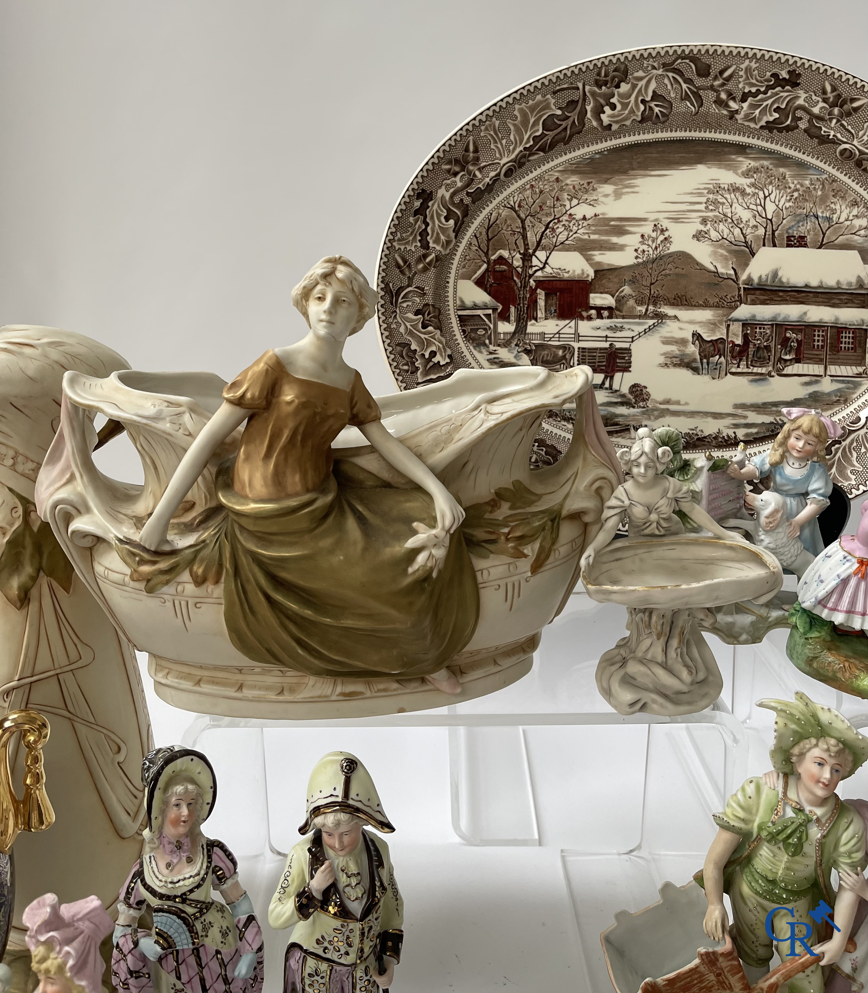 A large lot of brocante including Royal Dux, Biscuit statues, porcelain, globes, spelter statues, table lamp, chandelier etc.