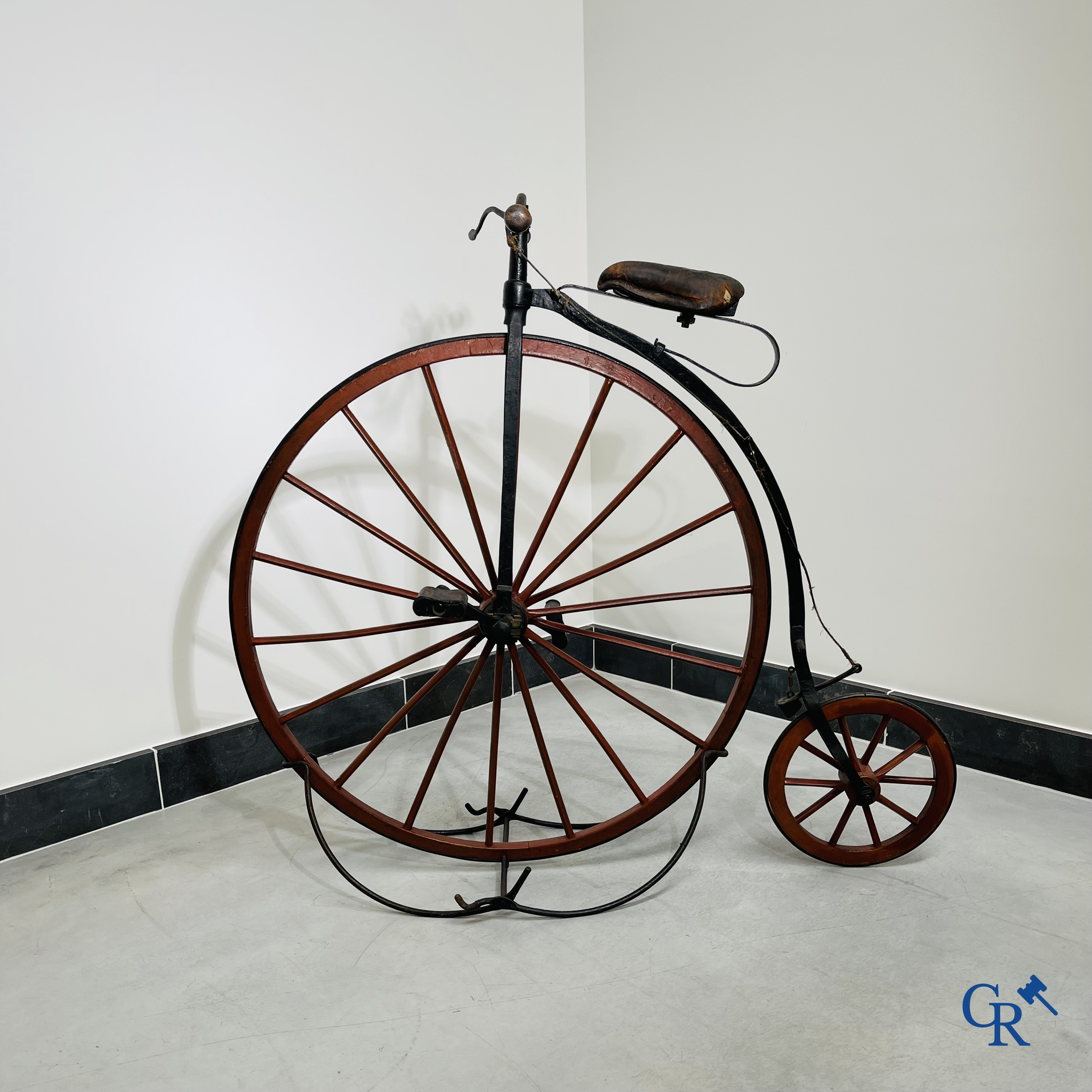 Penny-farthing with wooden spoked wheels on the original wrought iron upright. Circa 1880.