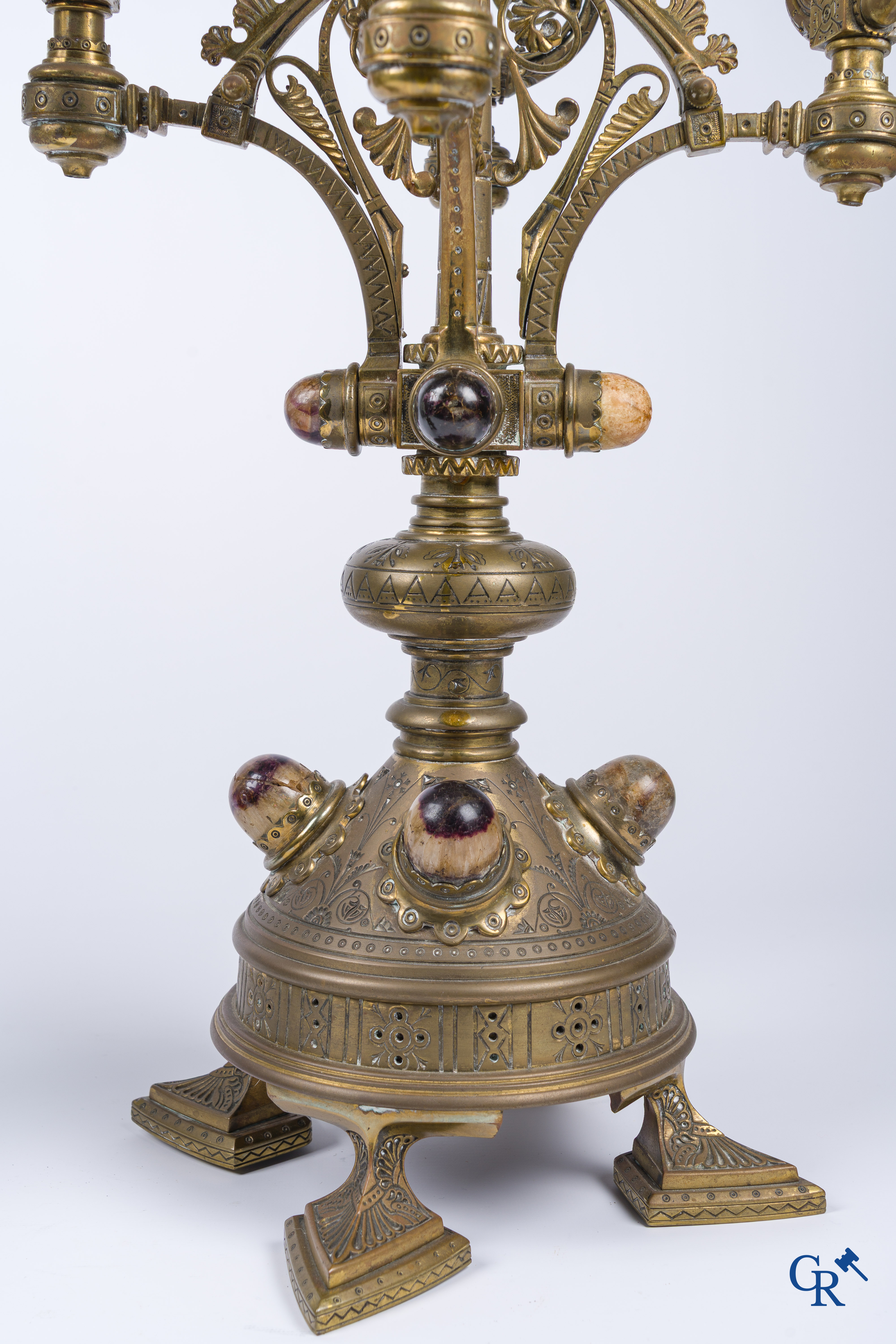 A pair of important bronze candlesticks decorated with various types of rock including amethyst. 19th century.