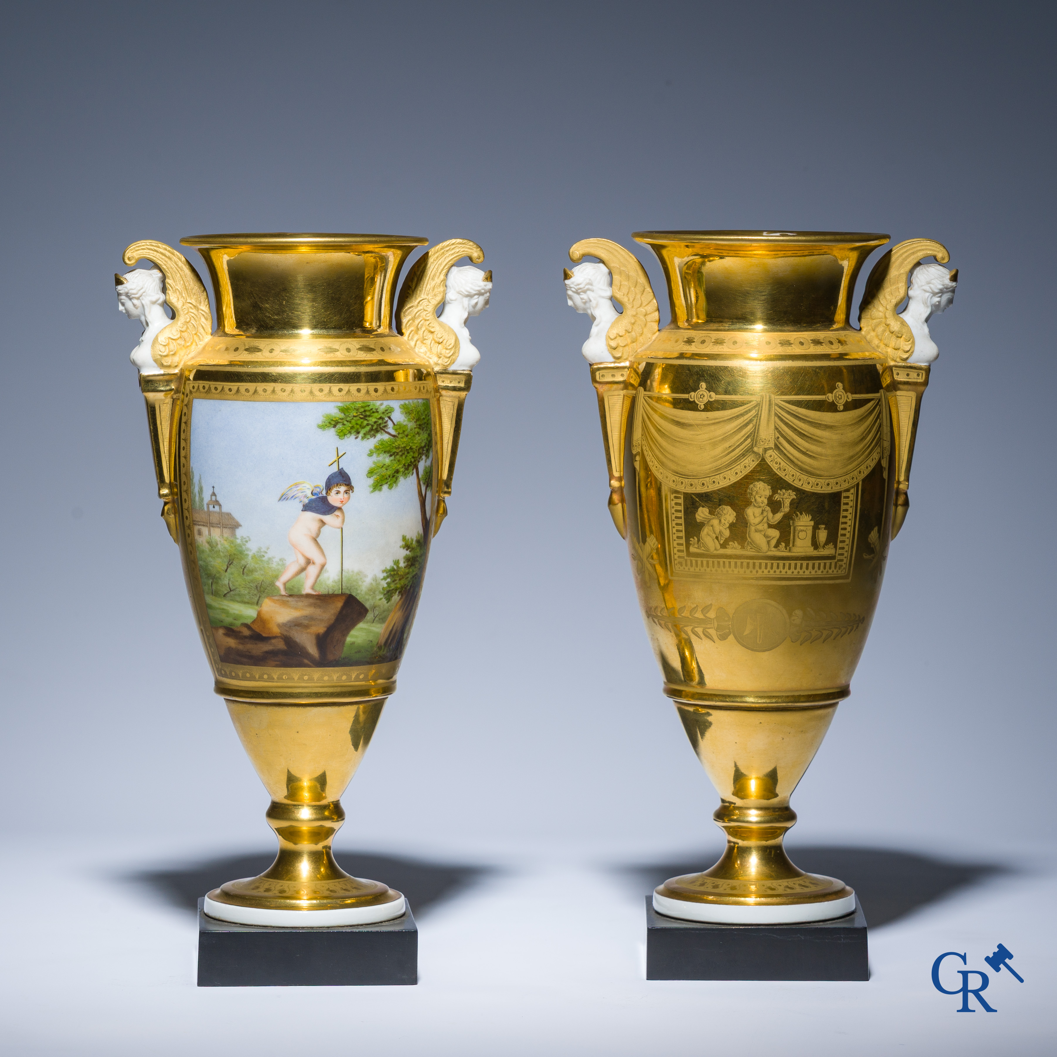 Empire, a pair of finely gilded and decorated vases in porcelain and biscuit on a marble pedestal, Circa 1810.