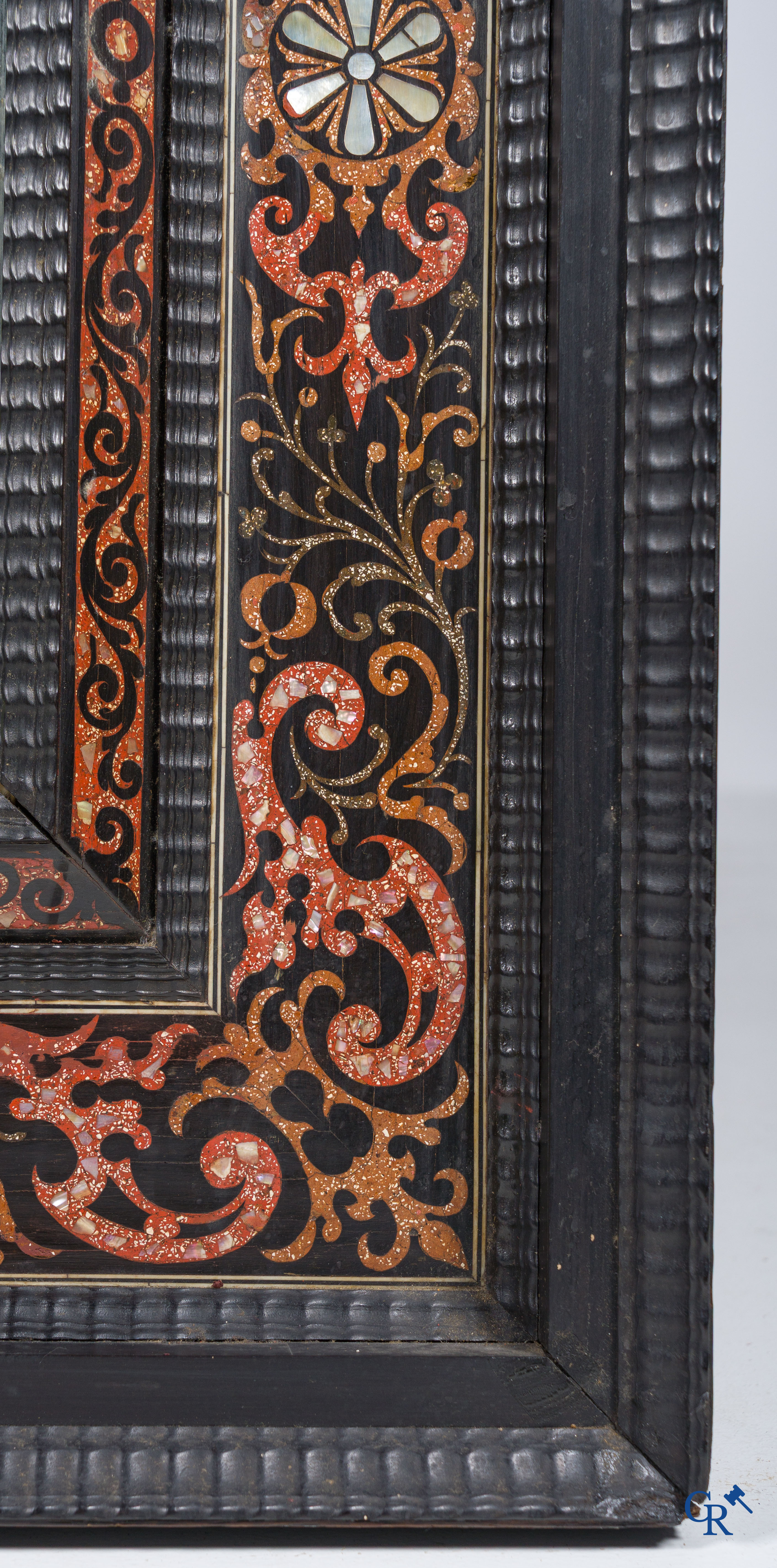 A mirror in ebony and inlay. 18th- 19th century.