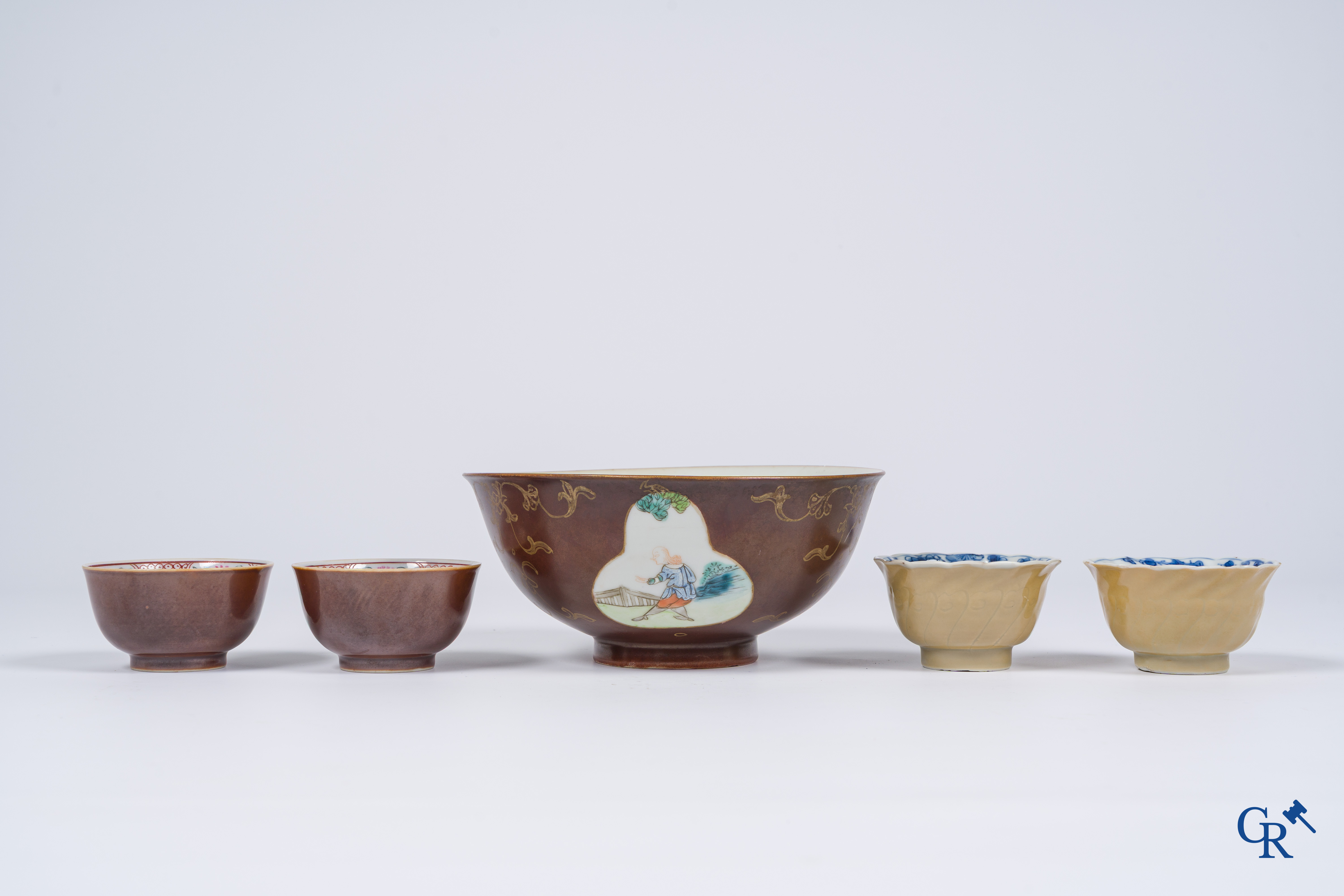 Asian Art, Chinese porcelain. A large Chinese "café au lait" bowl and saucer. 4 cups with saucers attached.