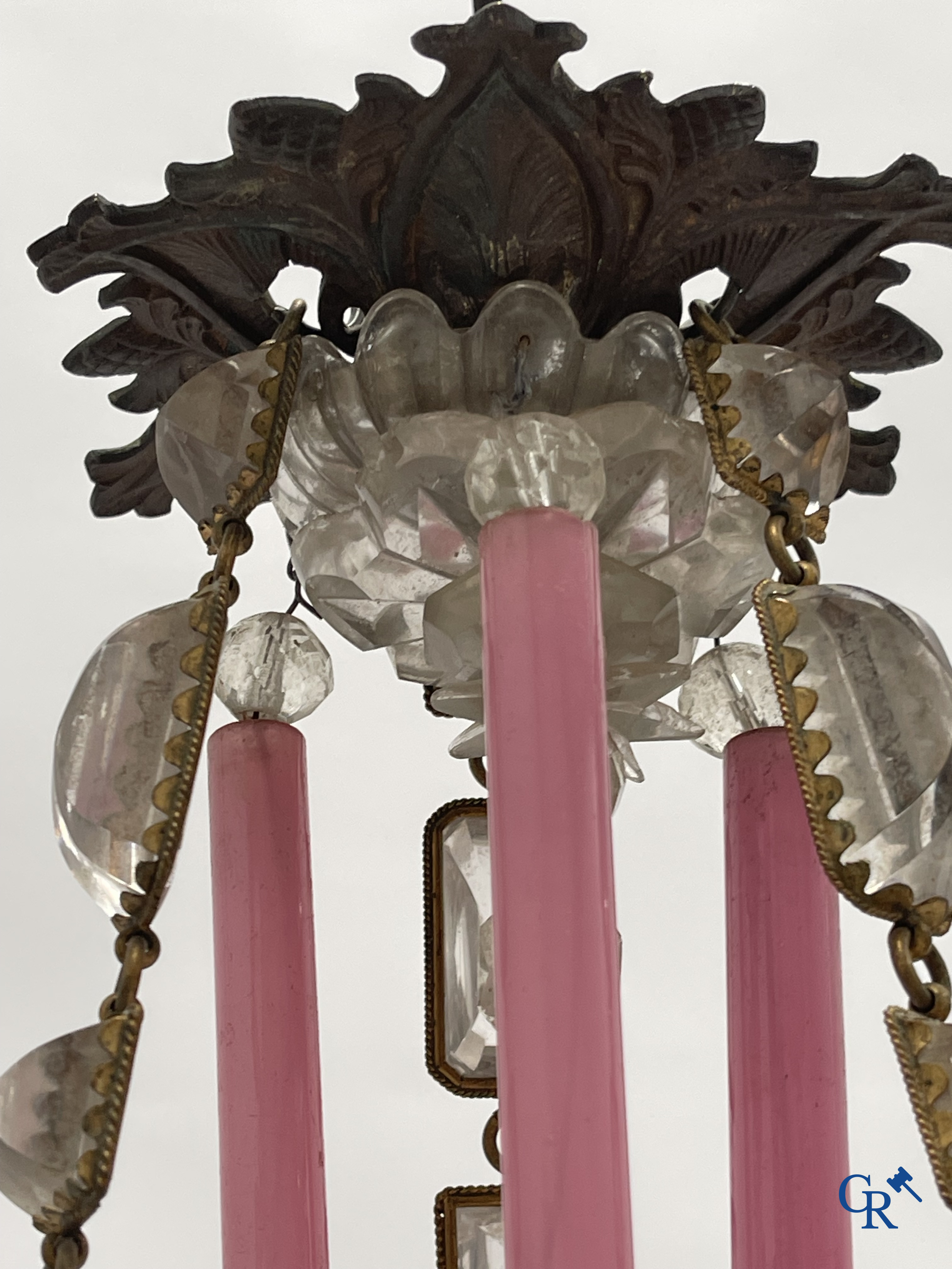 A chandelier in pink opaline and gilded frames with mounted crystal in the style of Baccarat. Circa 1860.