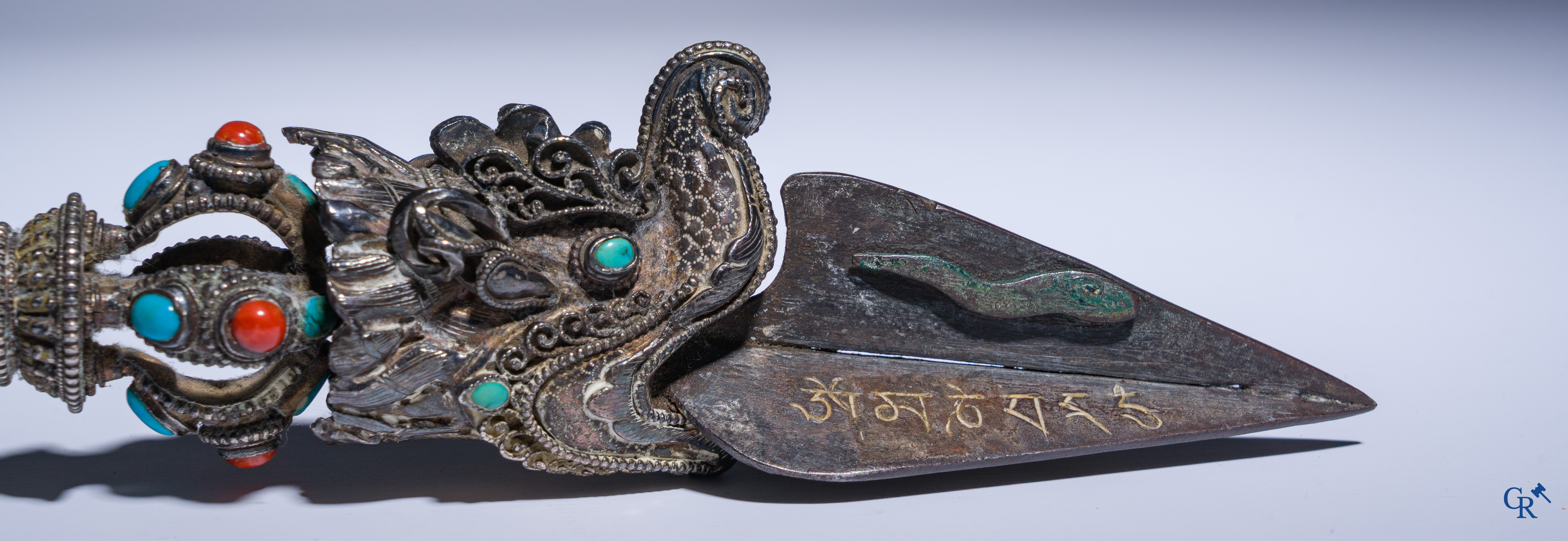Asian Art, Phurba. Tibetan ritual dagger in silver, inlaid with turquoise and red coral.