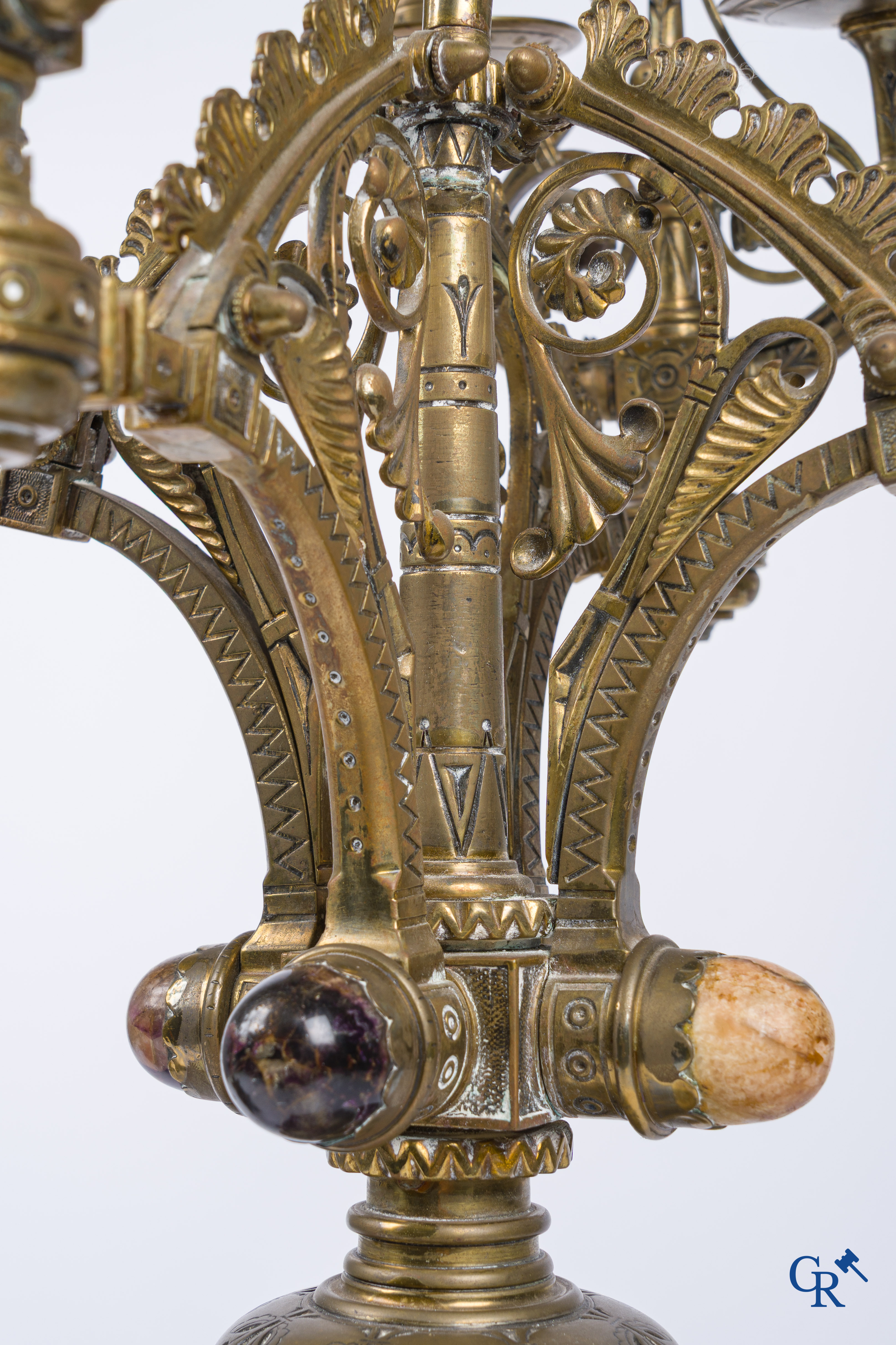 A pair of important bronze candlesticks decorated with various types of rock including amethyst. 19th century.