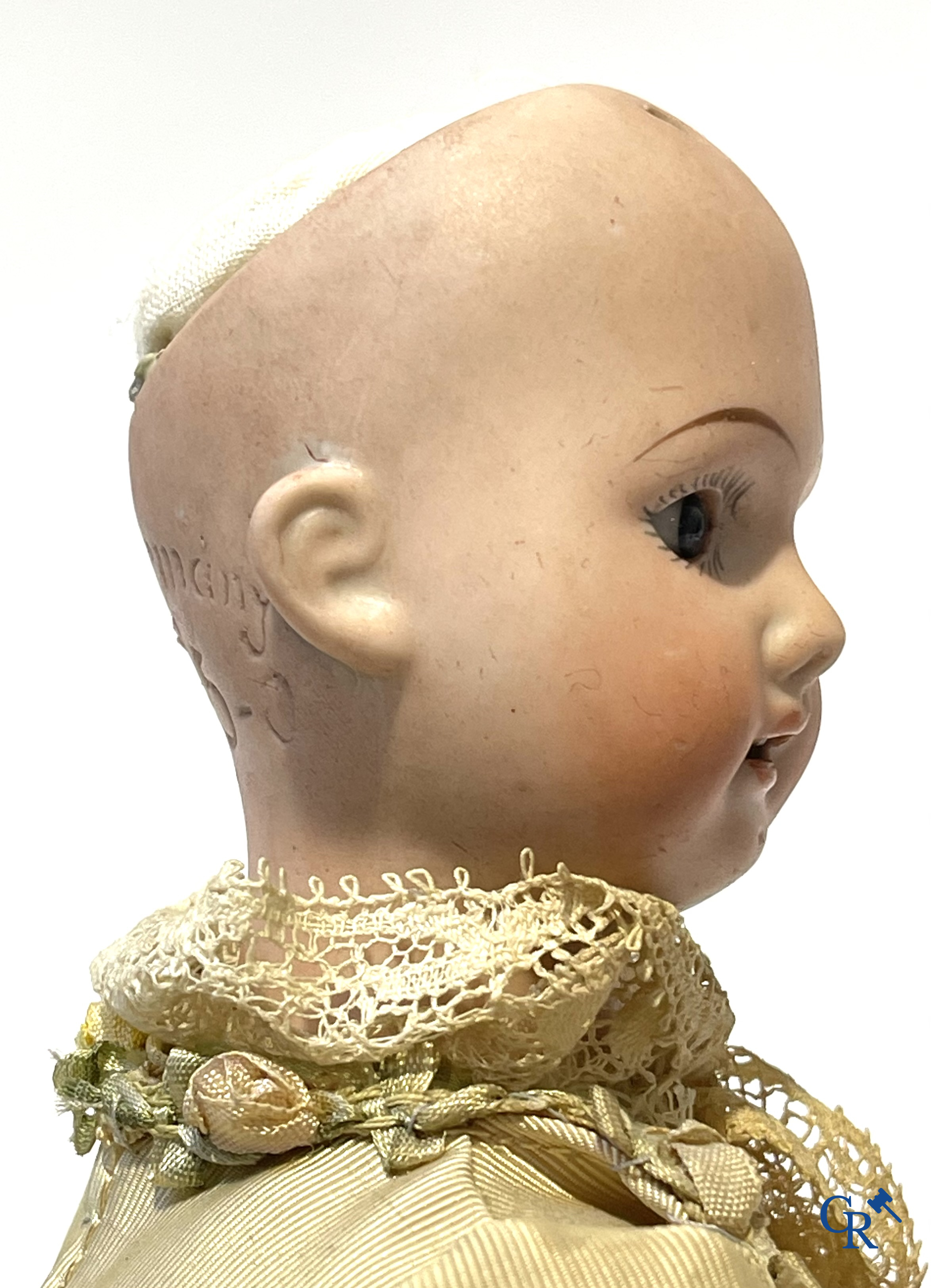 Old toys, 2 antique dolls with porcelain head and an automaton with music. Marked.