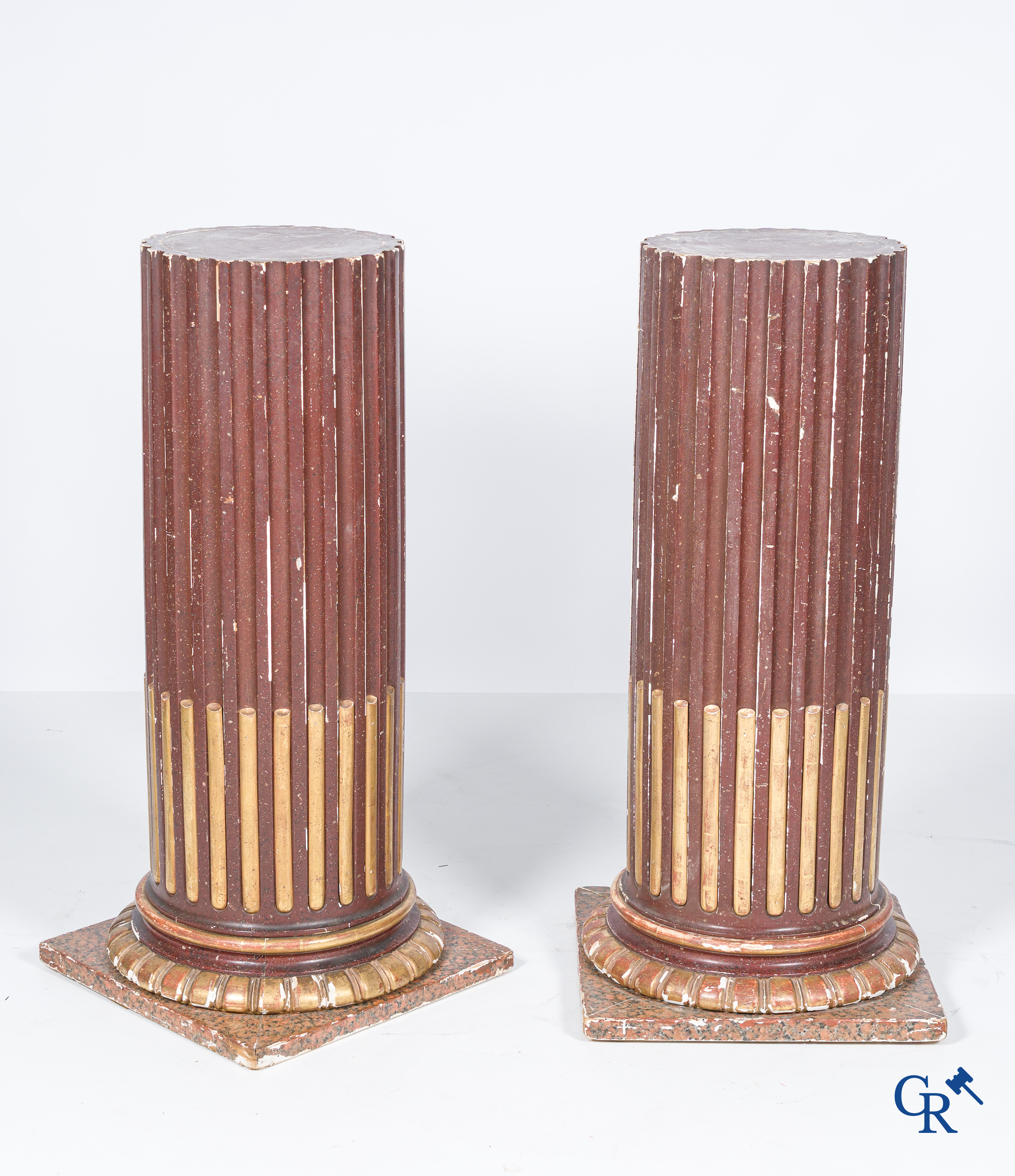 A pair of fluted, patinated and gilded wood sculpted columns. 19th century.