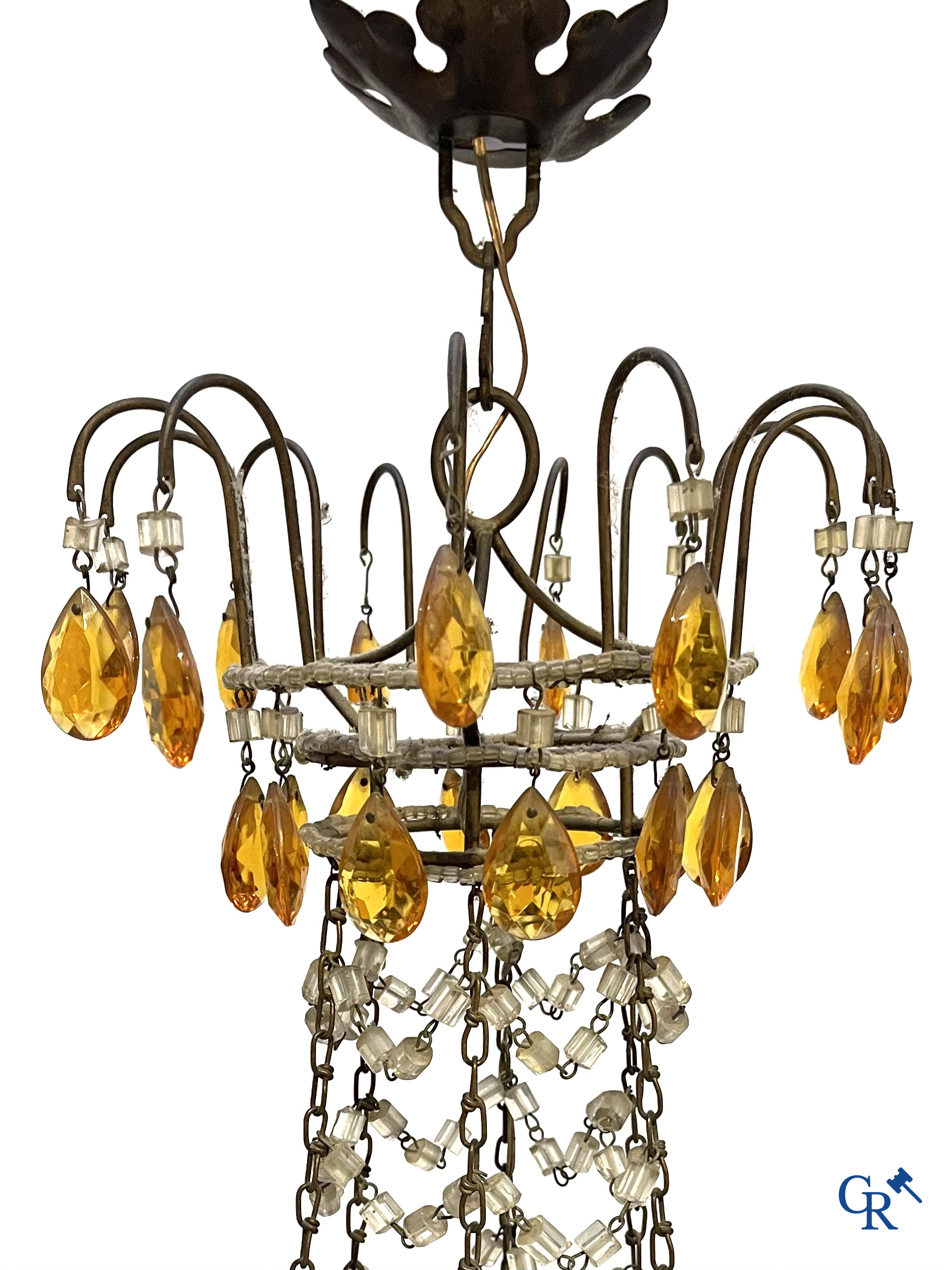 A large chandelier in crystal with double pearls on the frame.