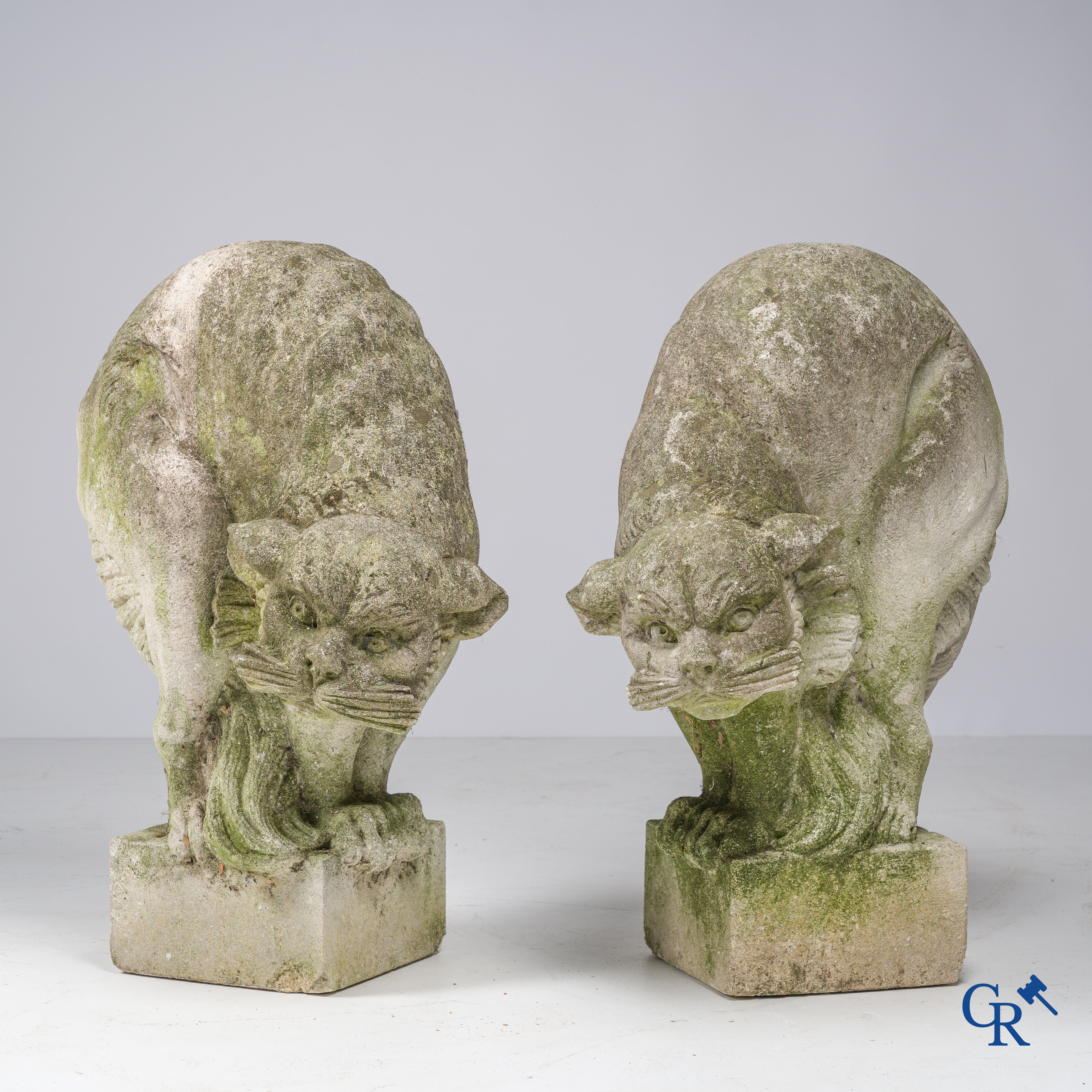 Exceptionally pair of large ornaments depicting cats in hand-sculpted limestone. Circa 1900.