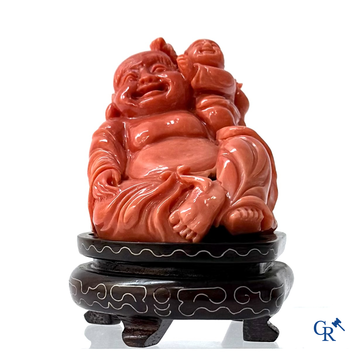 Asian Art, a Chinese carved red coral Buddha figure with child.