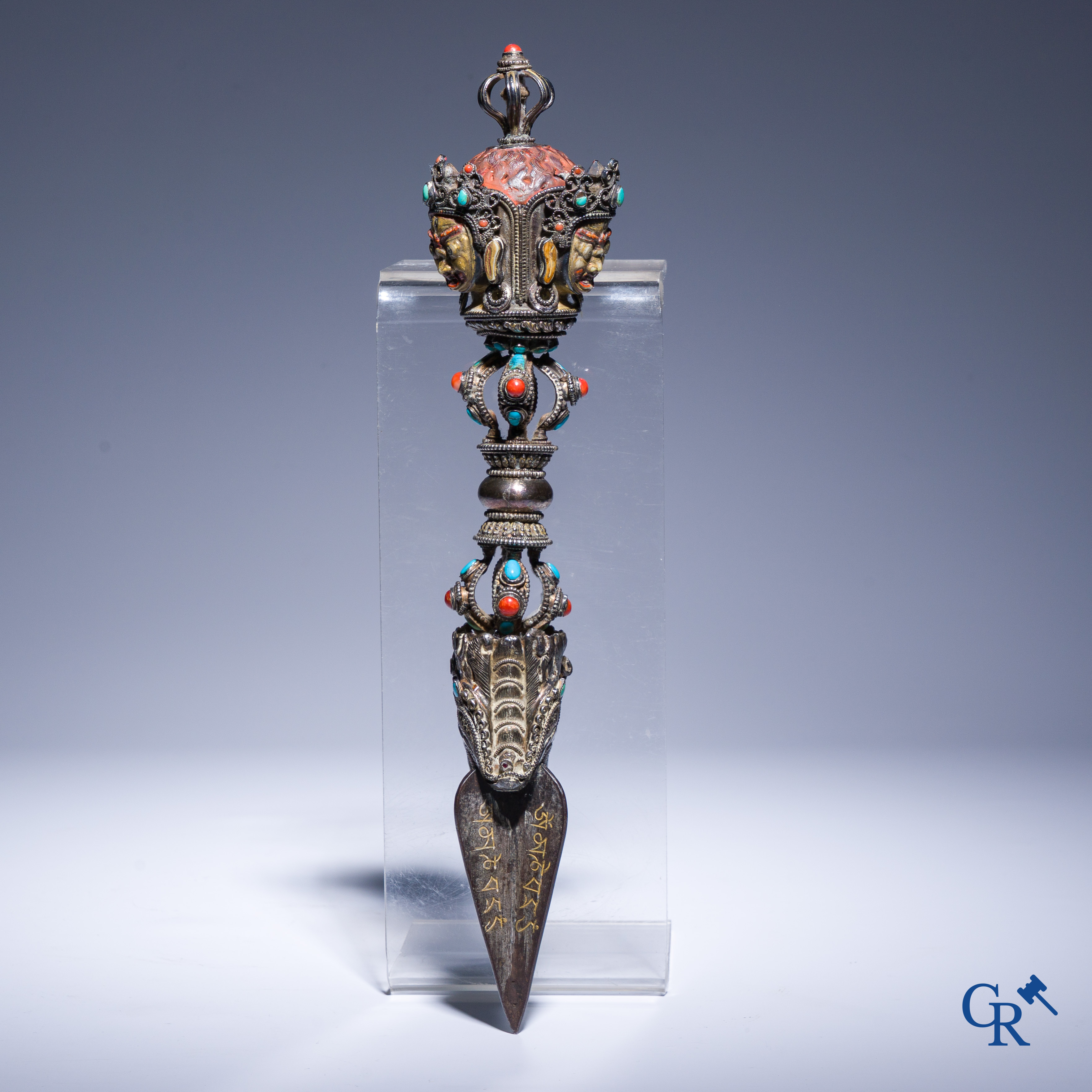 Asian Art, Phurba. Tibetan ritual dagger in silver, inlaid with turquoise and red coral.