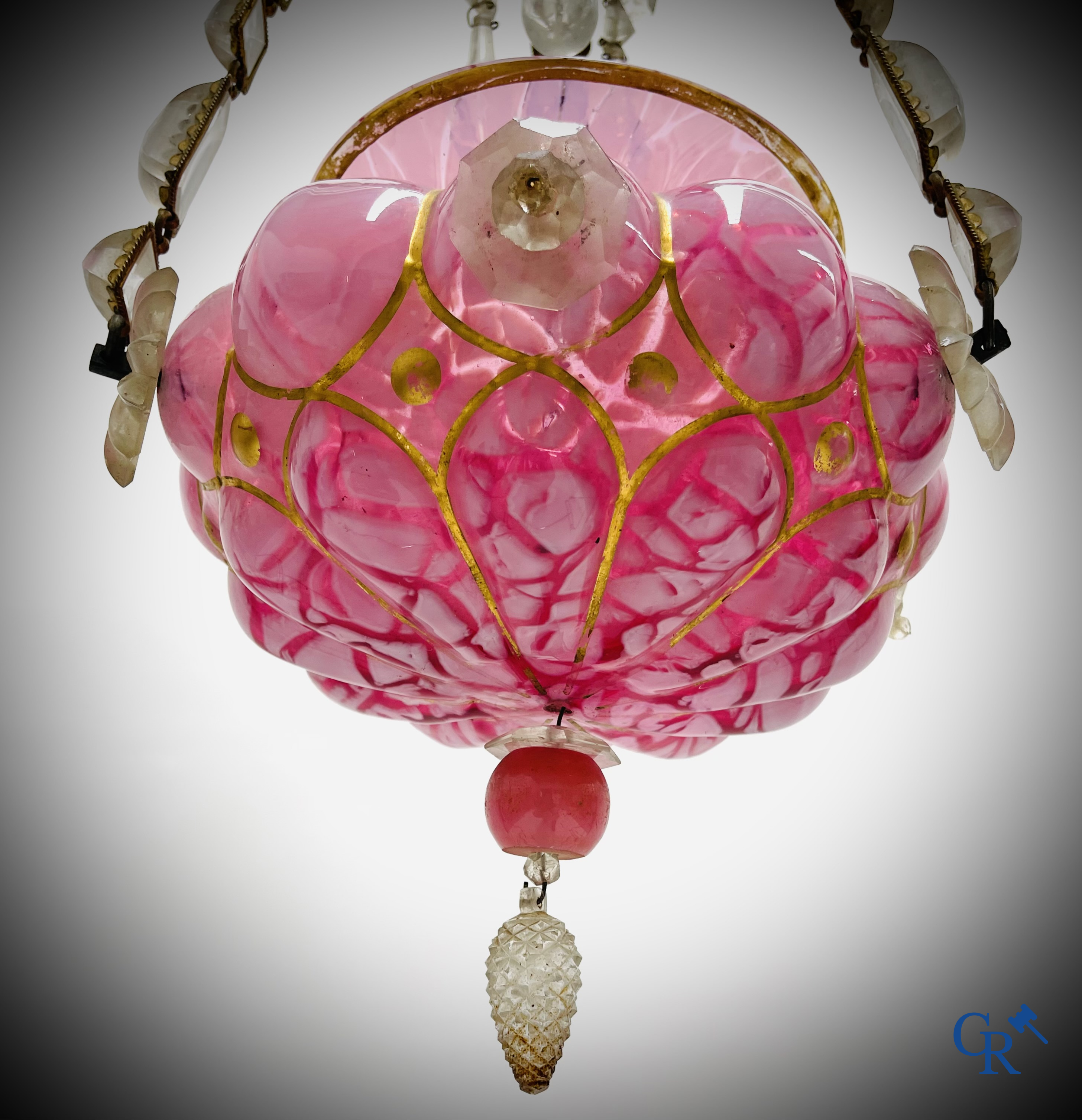 A chandelier in pink opaline and gilded frames with mounted crystal in the style of Baccarat. Circa 1860.