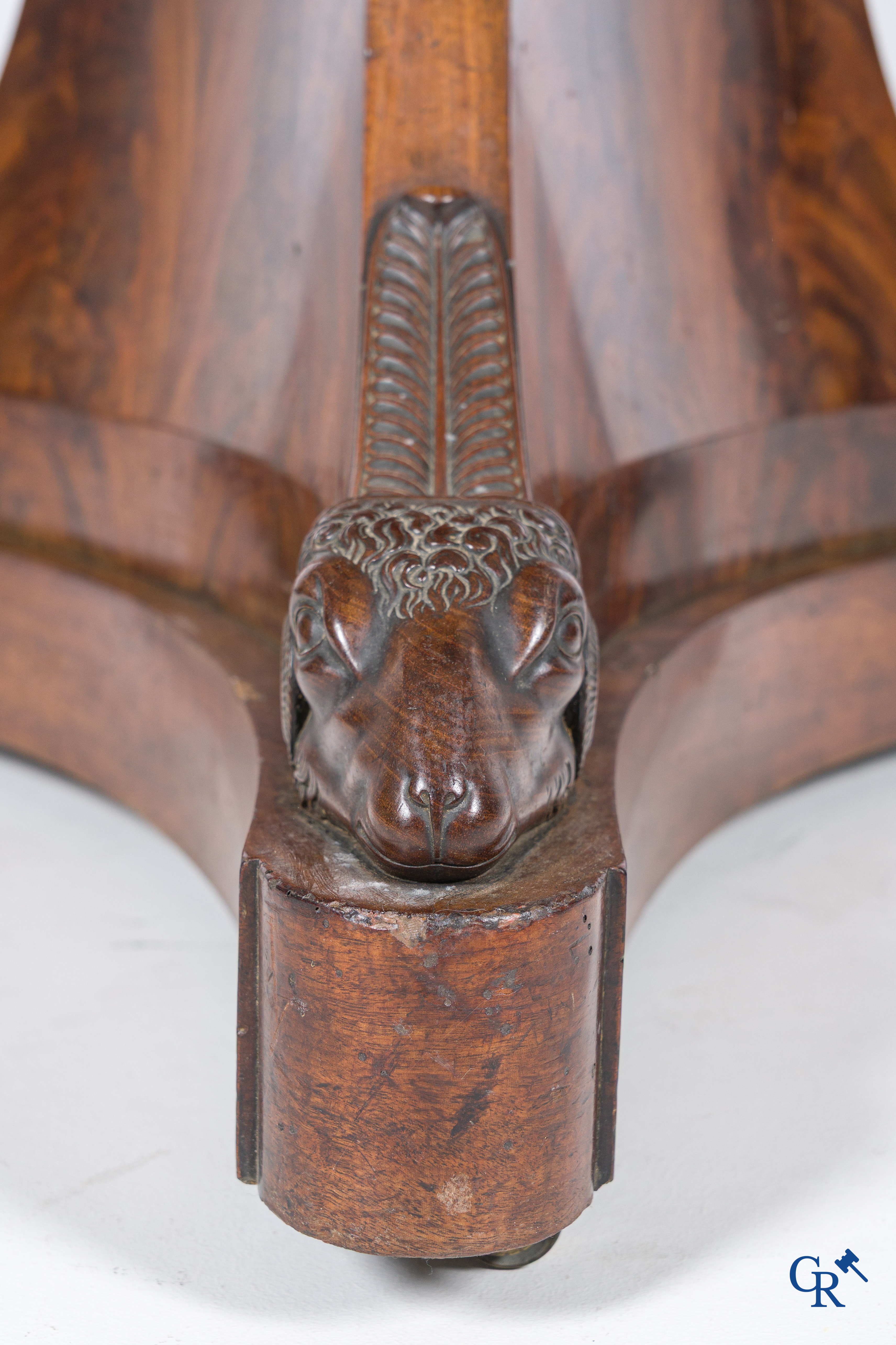 Large round three-legged table with ram heads in mahogany and white marble top. Empire period. 1st quarter 19th century.