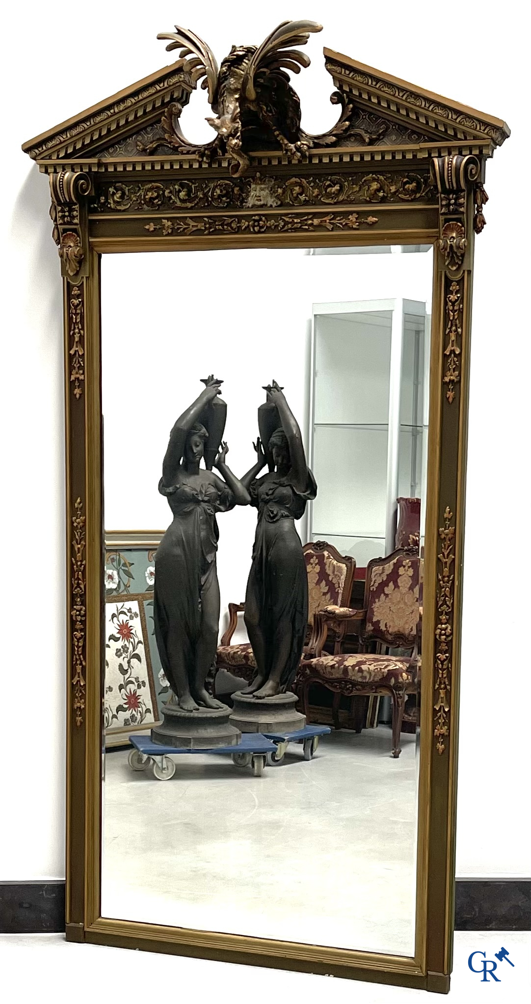 A large patinated fireplace mirror with a dragon. Around 1900.