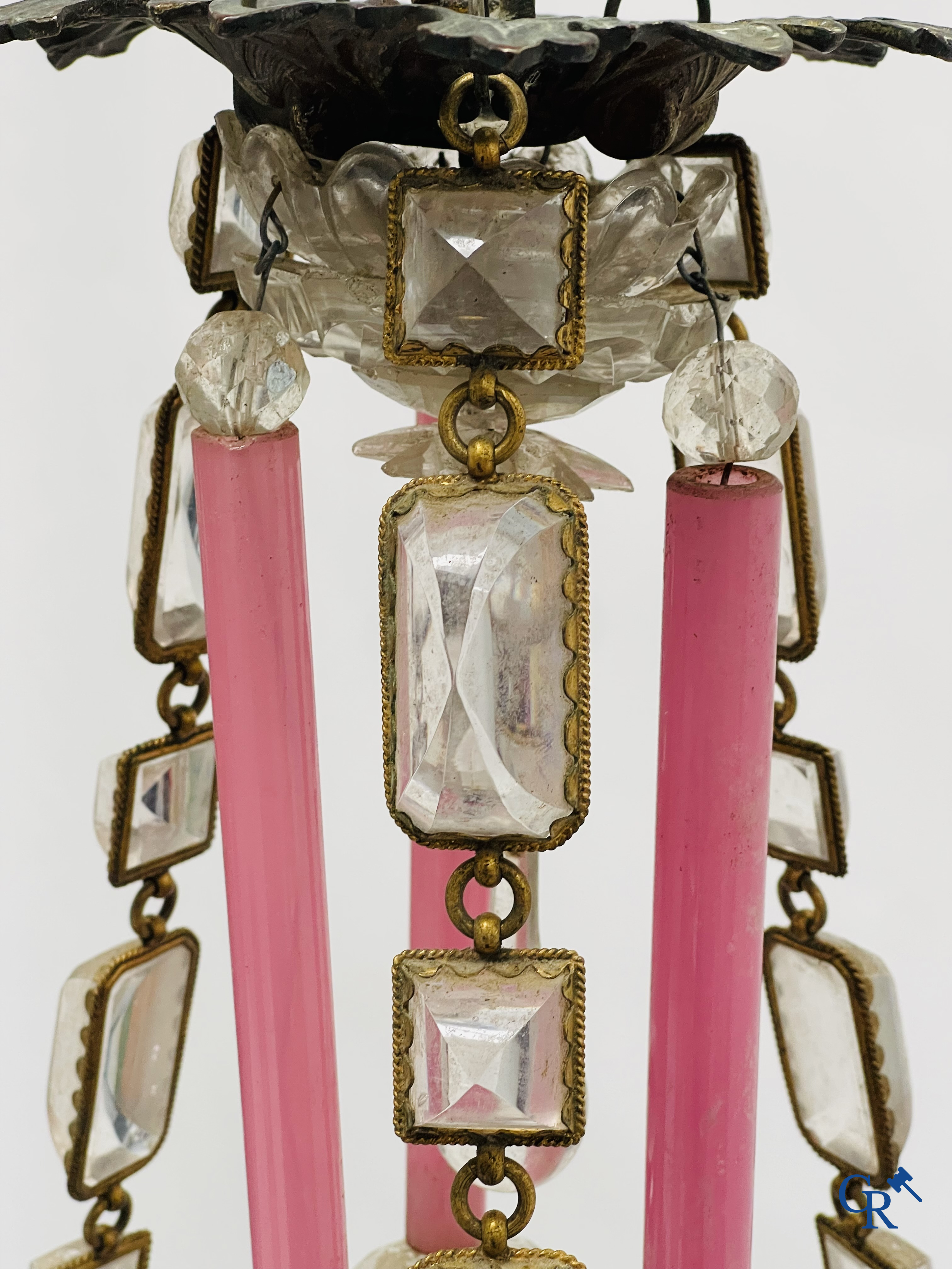 A chandelier in pink opaline and gilded frames with mounted crystal in the style of Baccarat. Circa 1860.