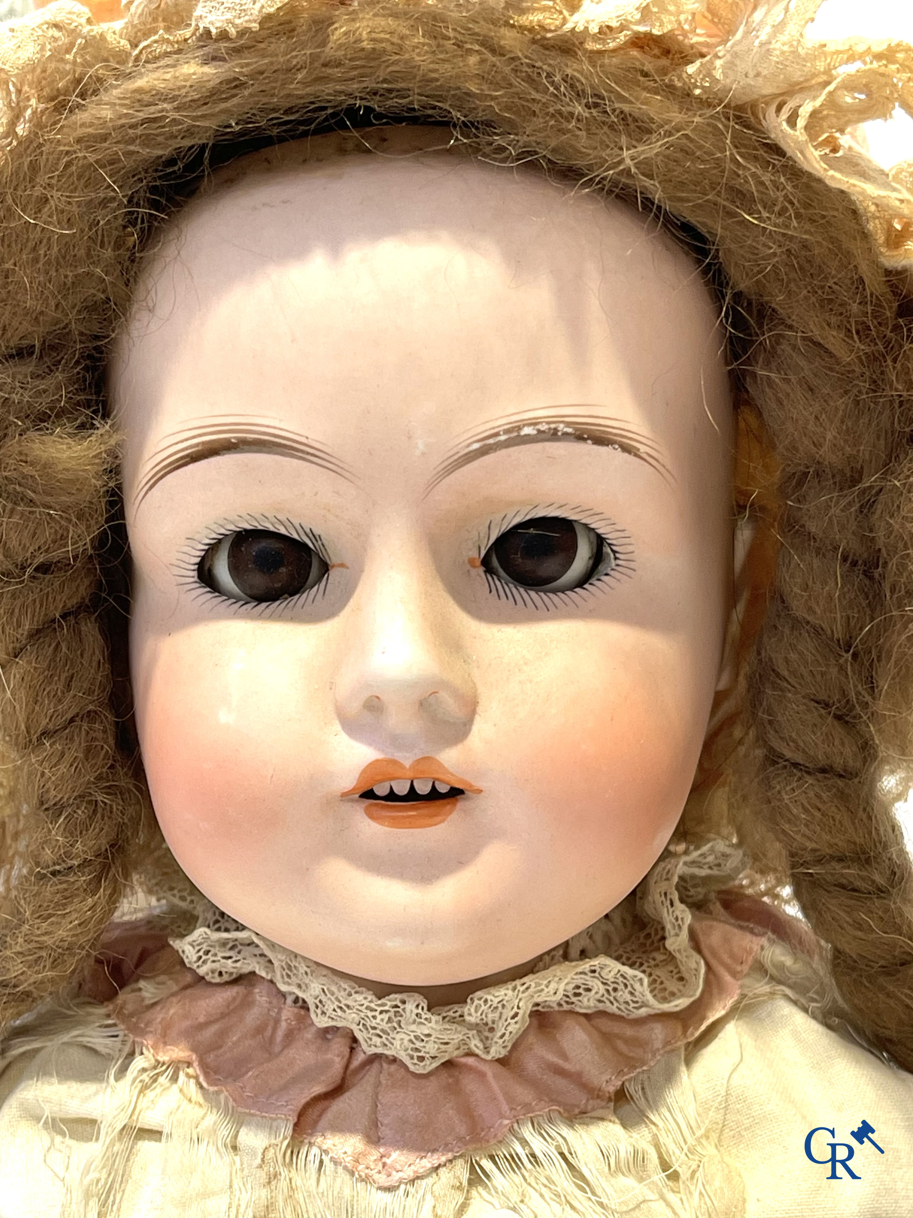 Old toys, 2 antique dolls with porcelain head and an automaton with music. Marked.