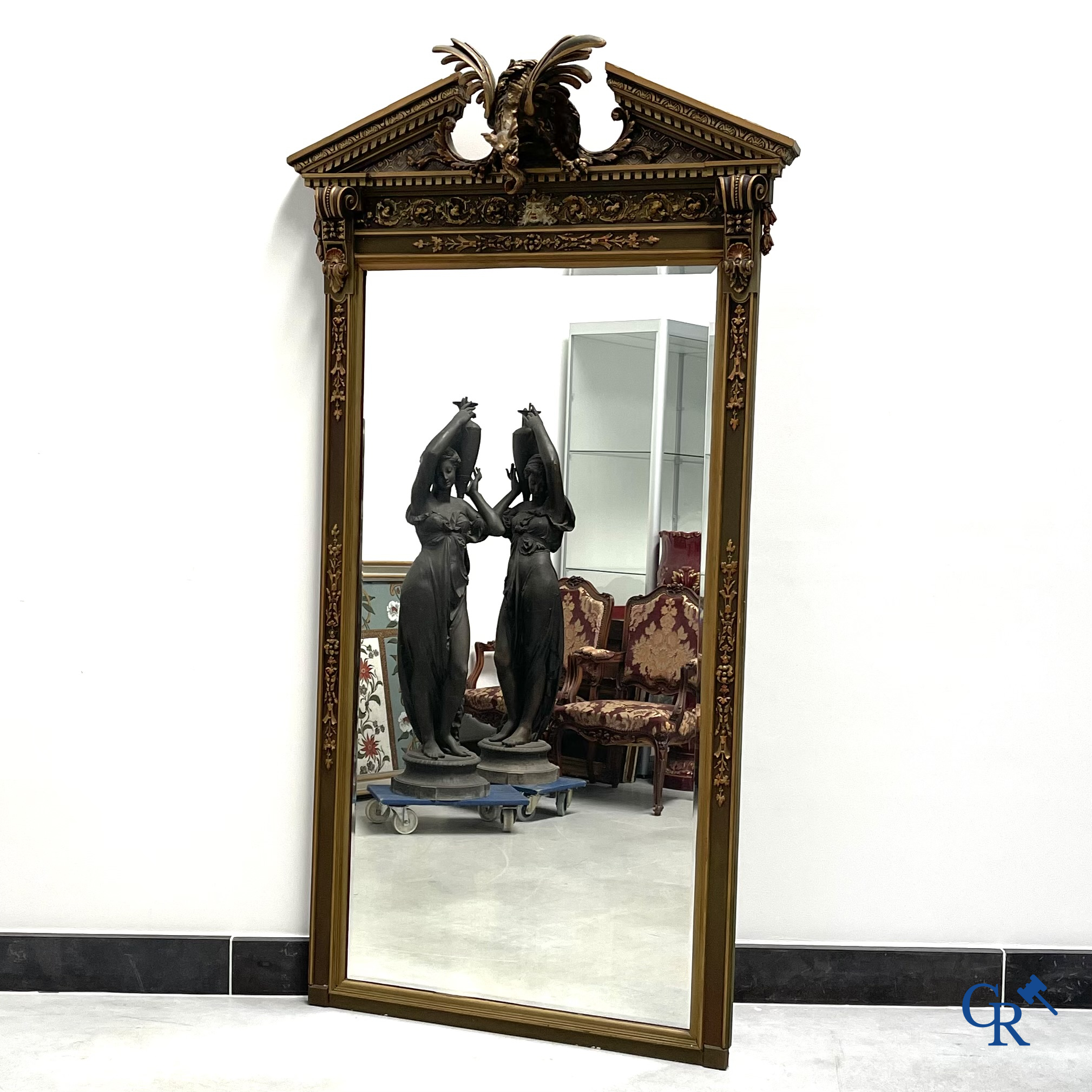 A large patinated fireplace mirror with a dragon. Around 1900.