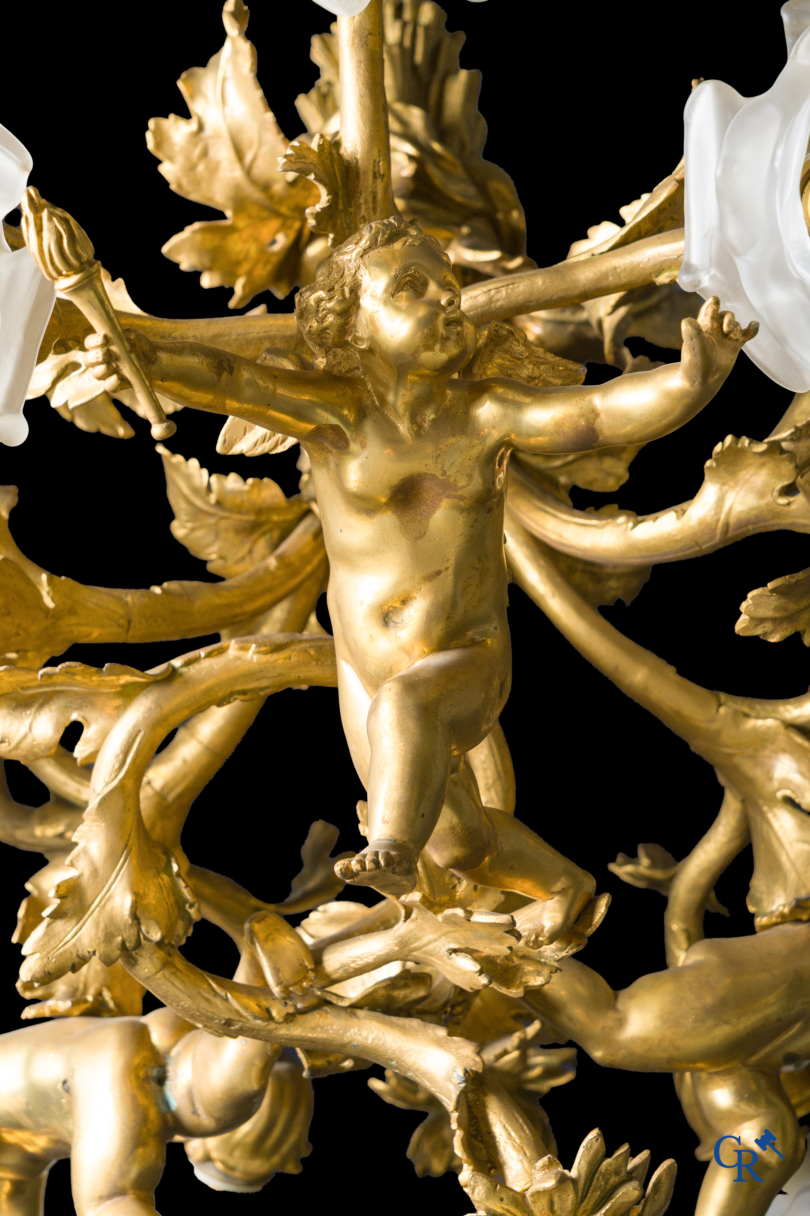 An imposing bronze gilded Napoleon III chandelier with 3 putti and 13 light points. LXVI style.