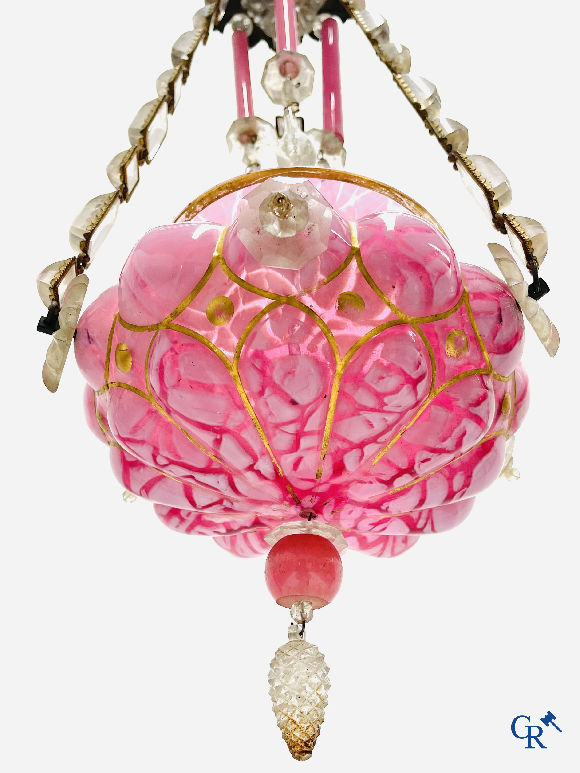 A chandelier in pink opaline and gilded frames with mounted crystal in the style of Baccarat. Circa 1860.