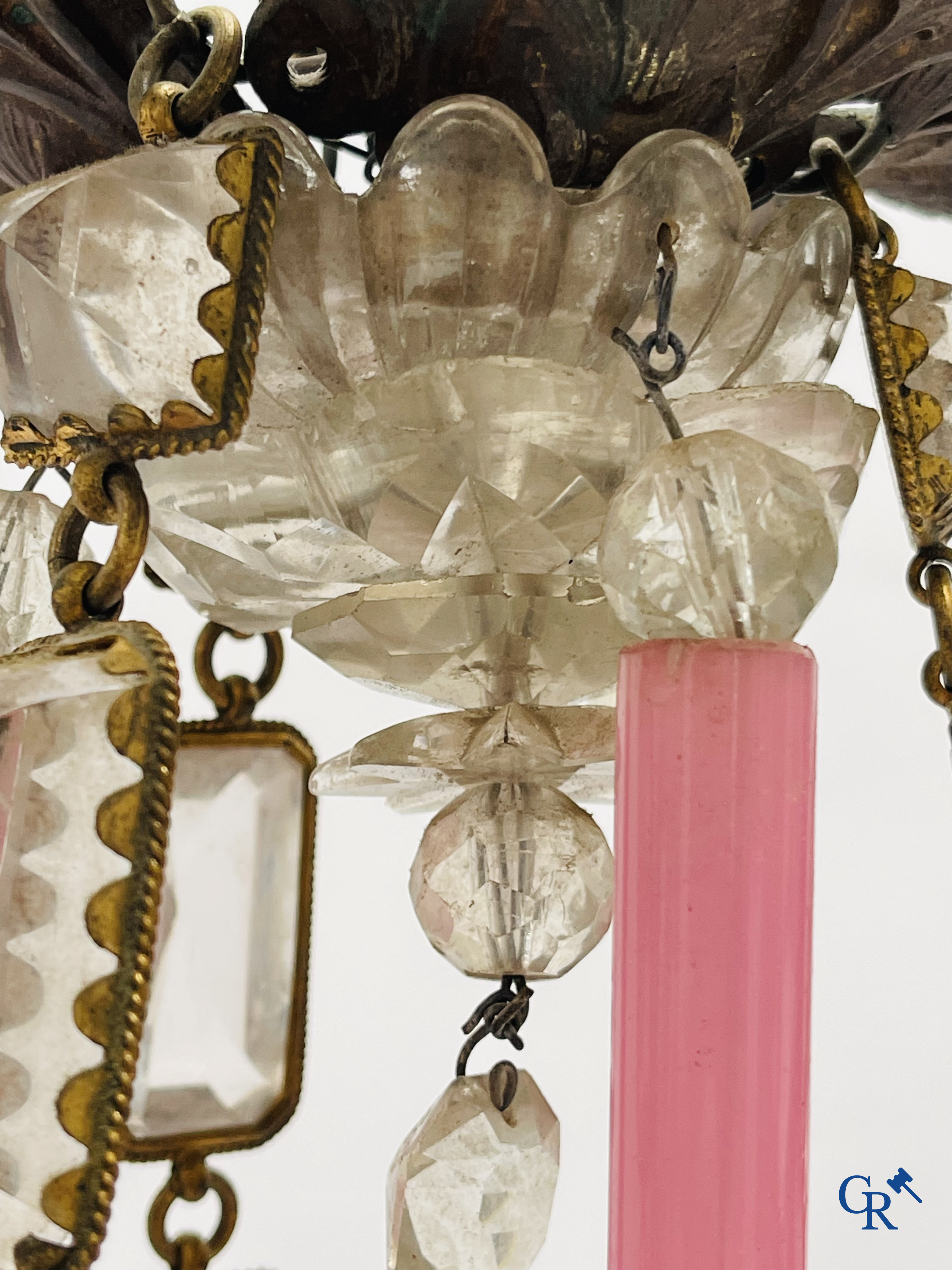 A chandelier in pink opaline and gilded frames with mounted crystal in the style of Baccarat. Circa 1860.
