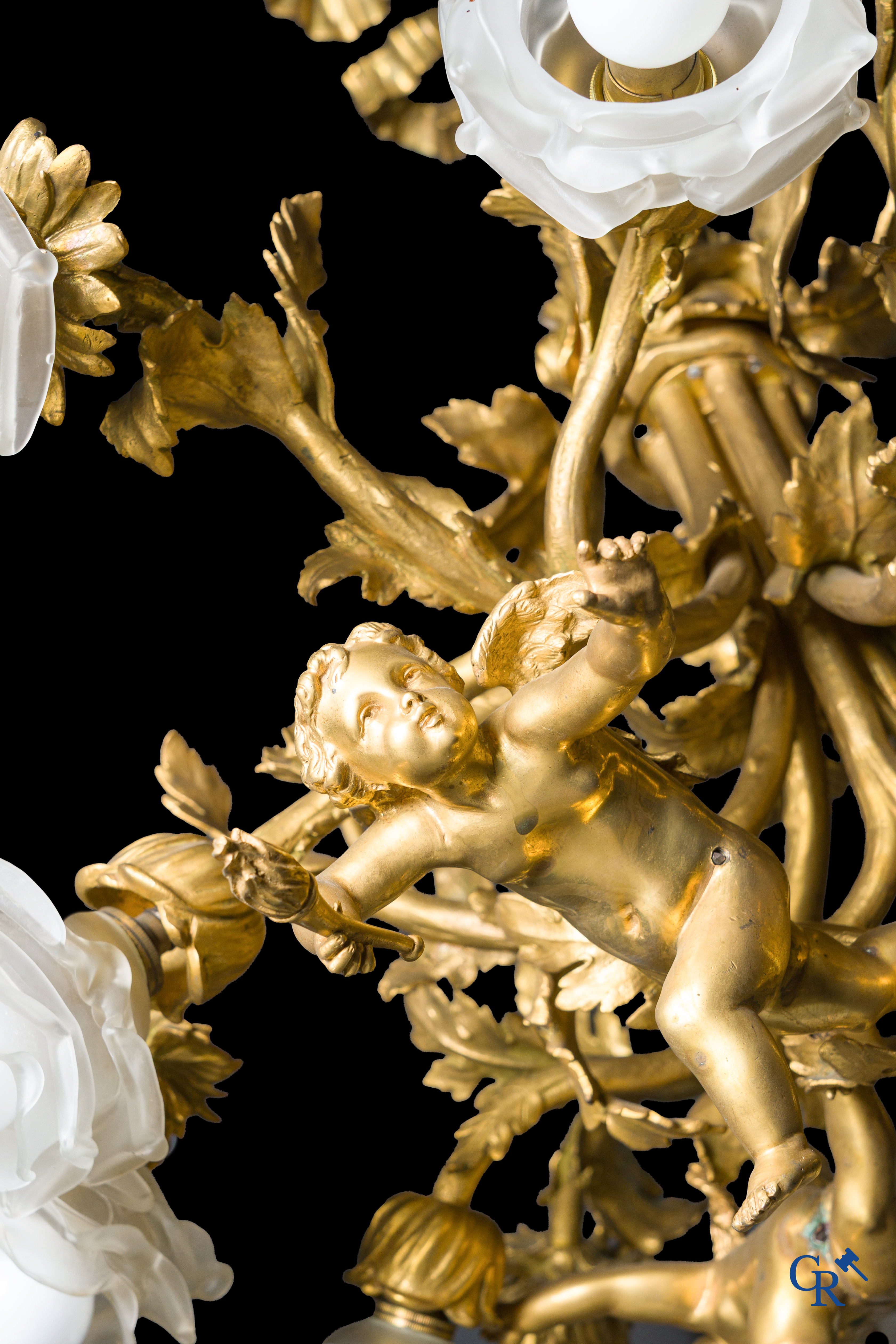 An imposing bronze gilded Napoleon III chandelier with 3 putti and 13 light points. LXVI style.