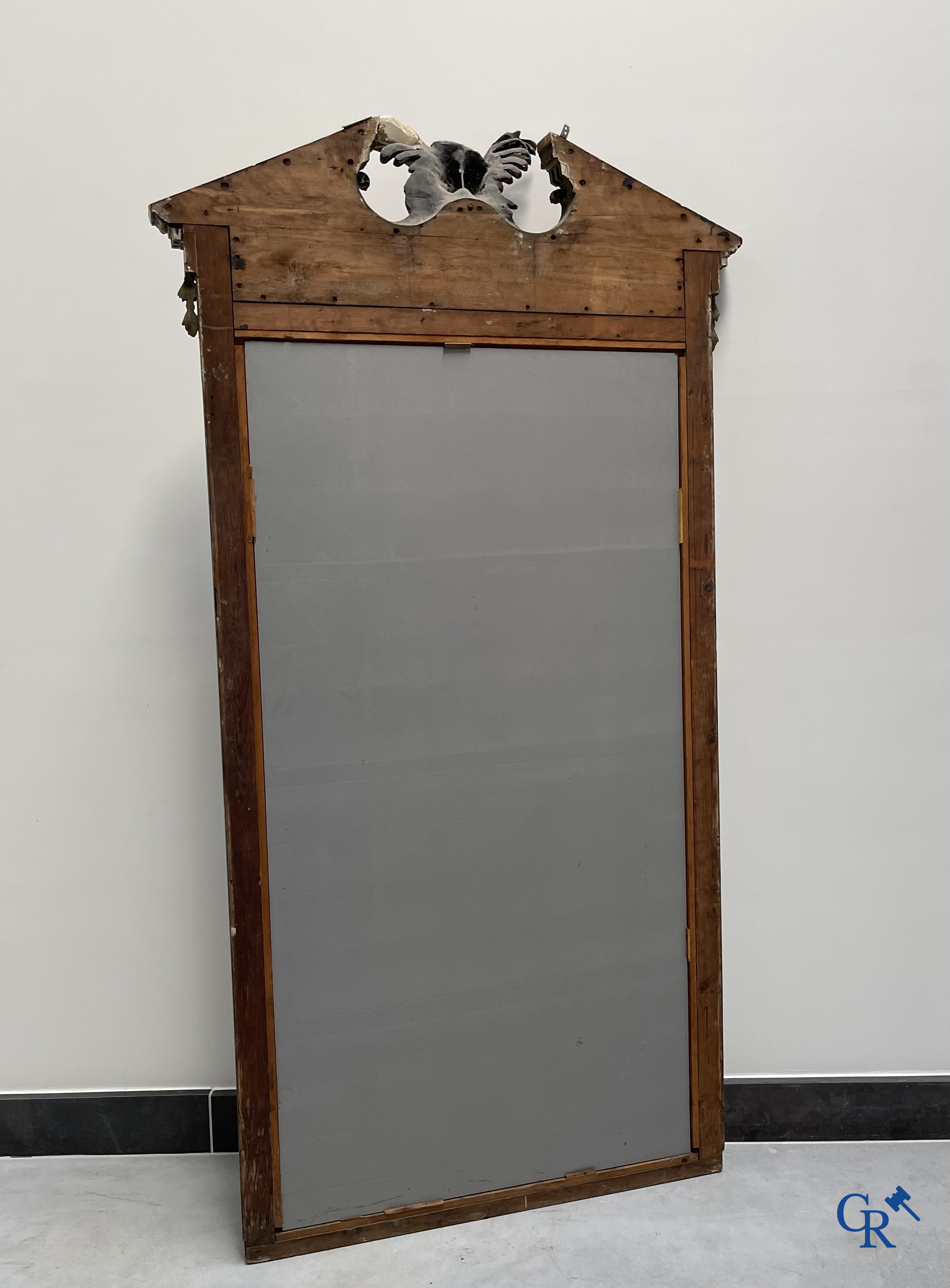 A large patinated fireplace mirror with a dragon. Around 1900.