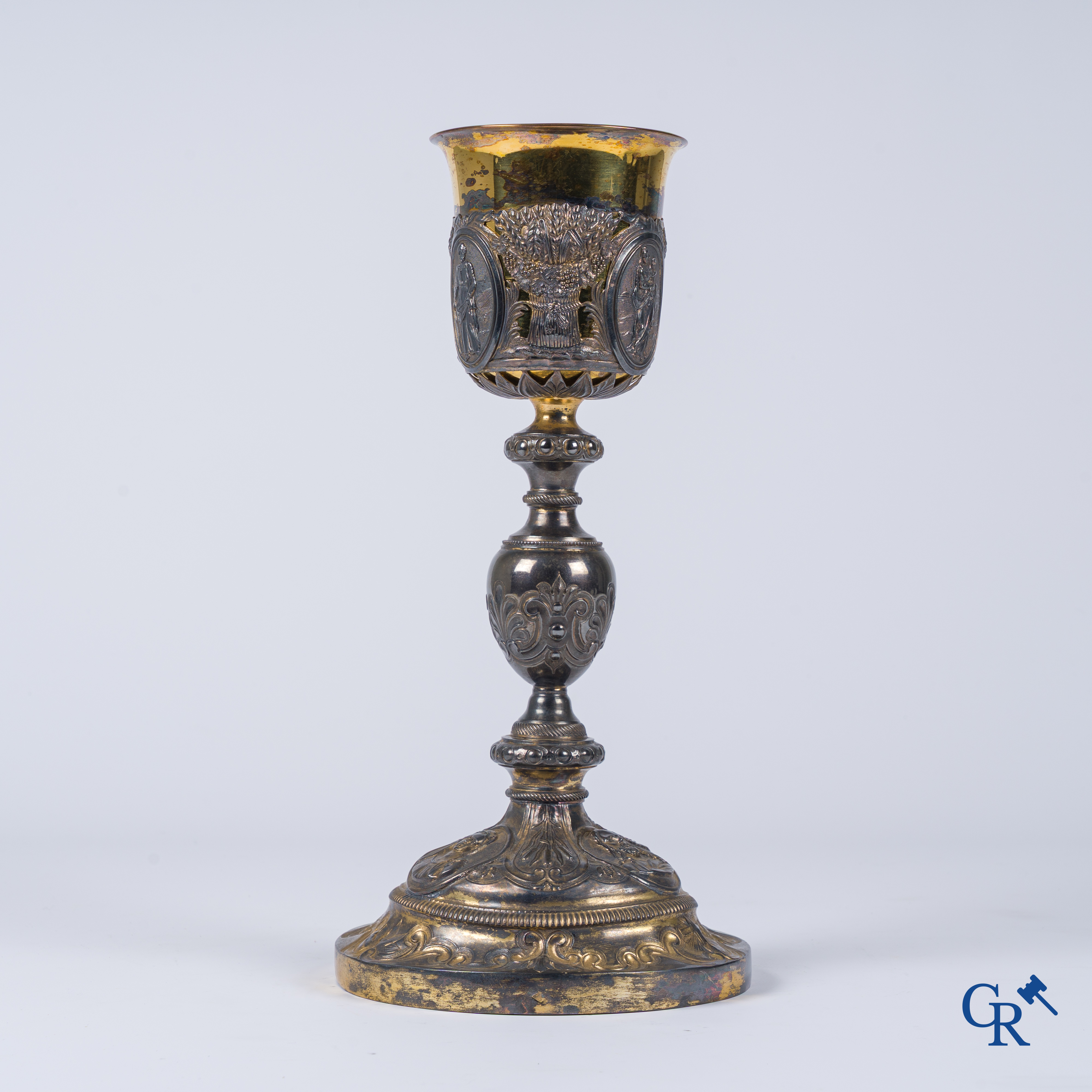 Martin & Dejean, orfèvres. A relief decorated chalice in silver and vermeil. Paris, 1st half of the 19th century.