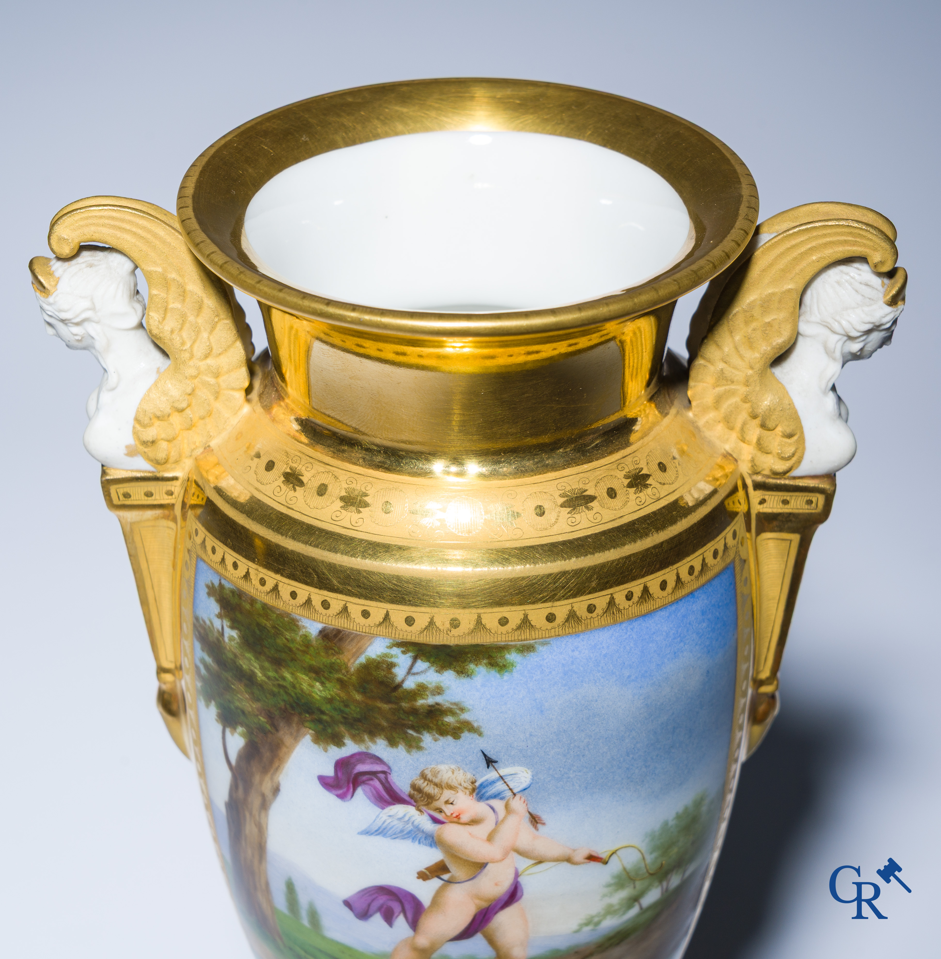 Empire, a pair of finely gilded and decorated vases in porcelain and biscuit on a marble pedestal, Circa 1810.
