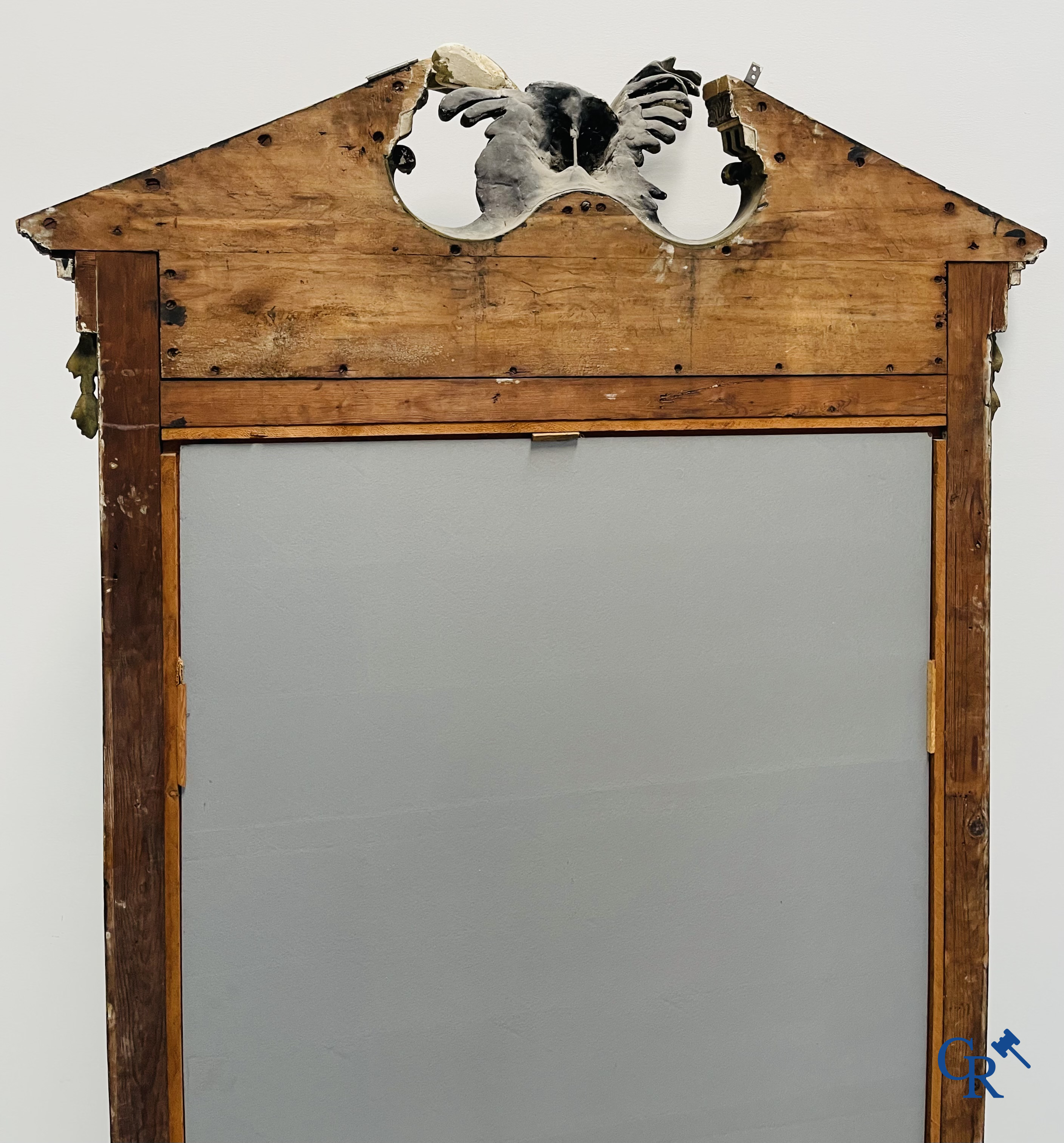A large patinated fireplace mirror with a dragon. Around 1900.