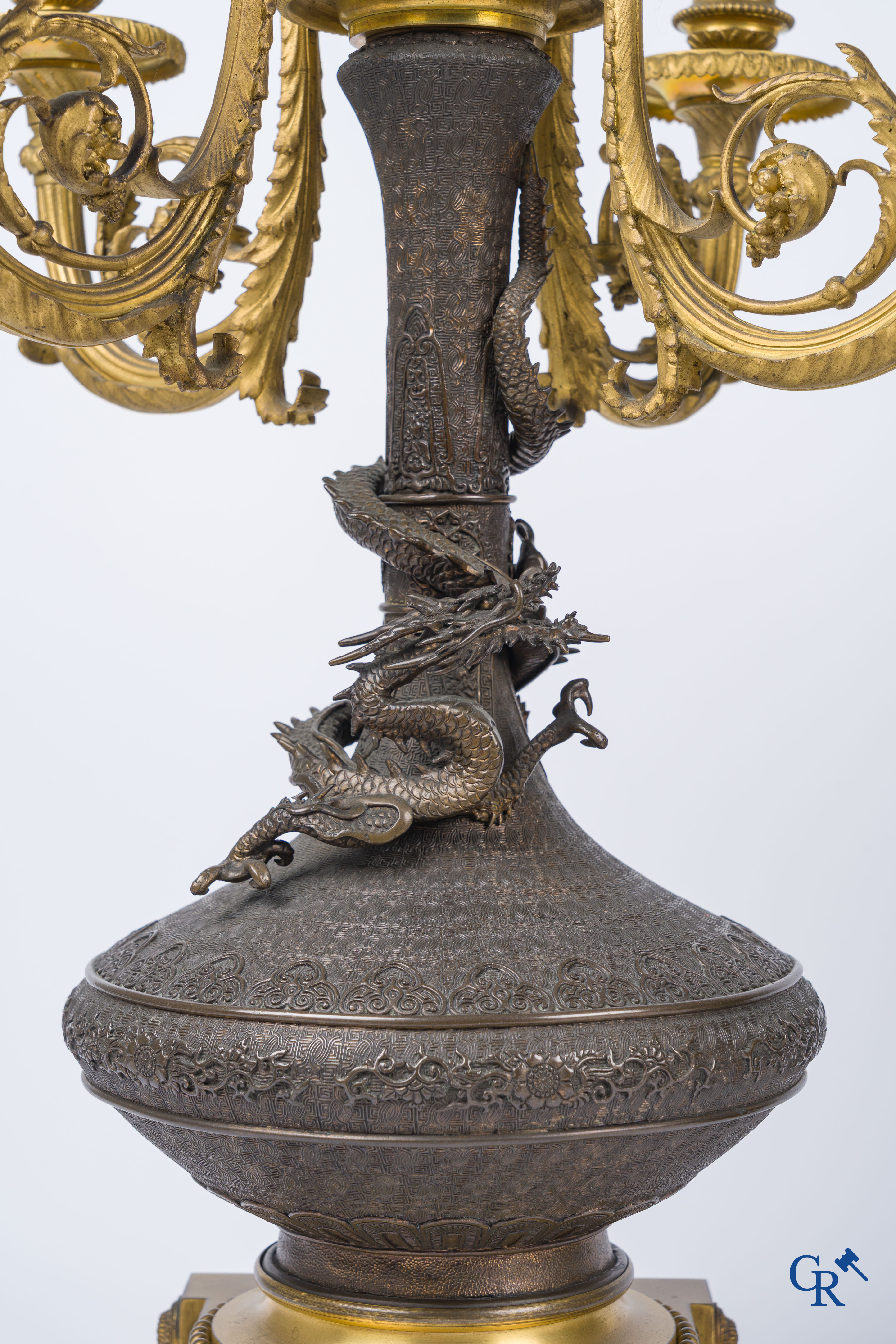 Asian Art, A pair of bronze candlesticks with finely crafted Oriental vases with dragons, circa 1880.