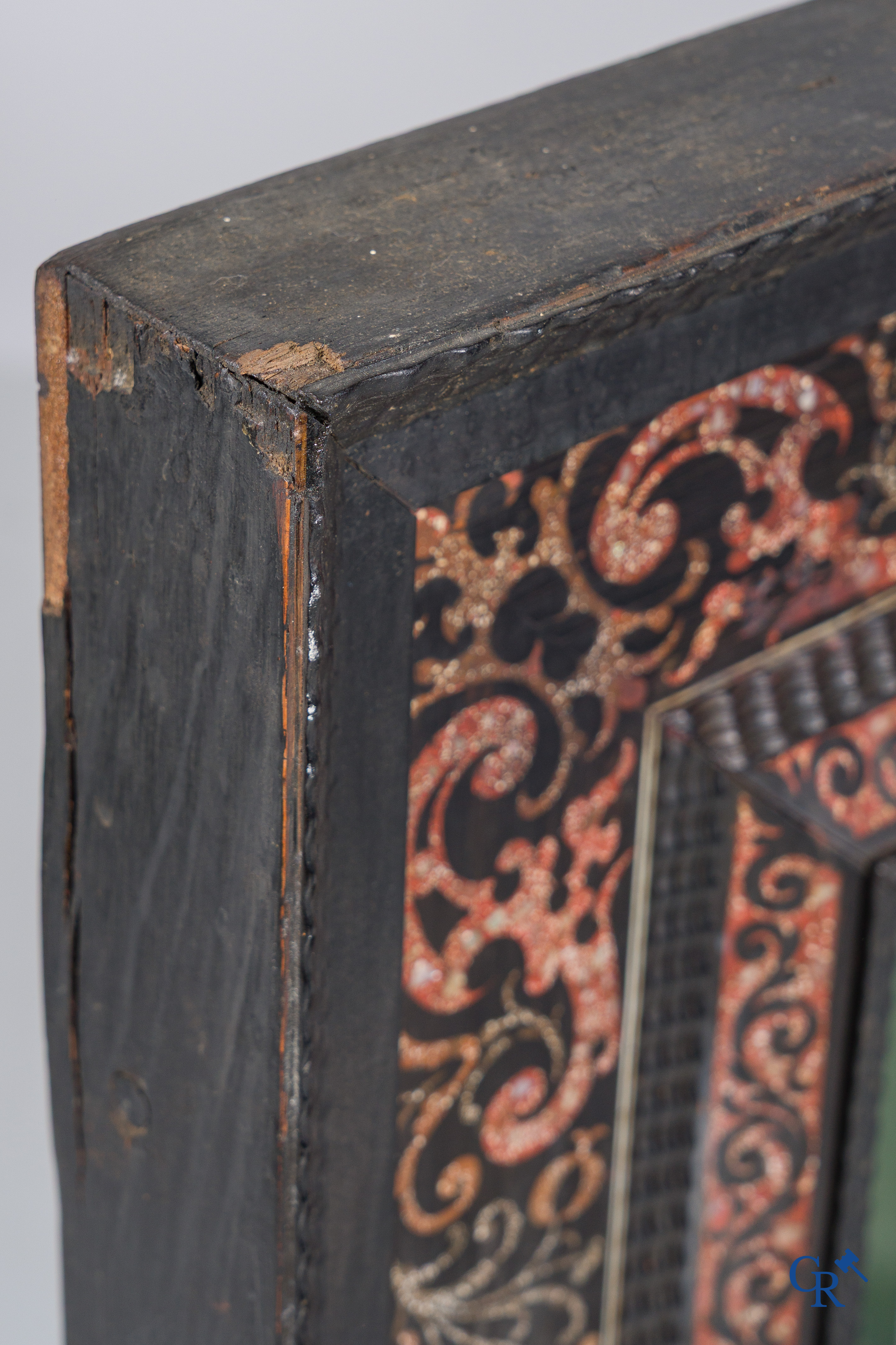 A mirror in ebony and inlay. 18th- 19th century.