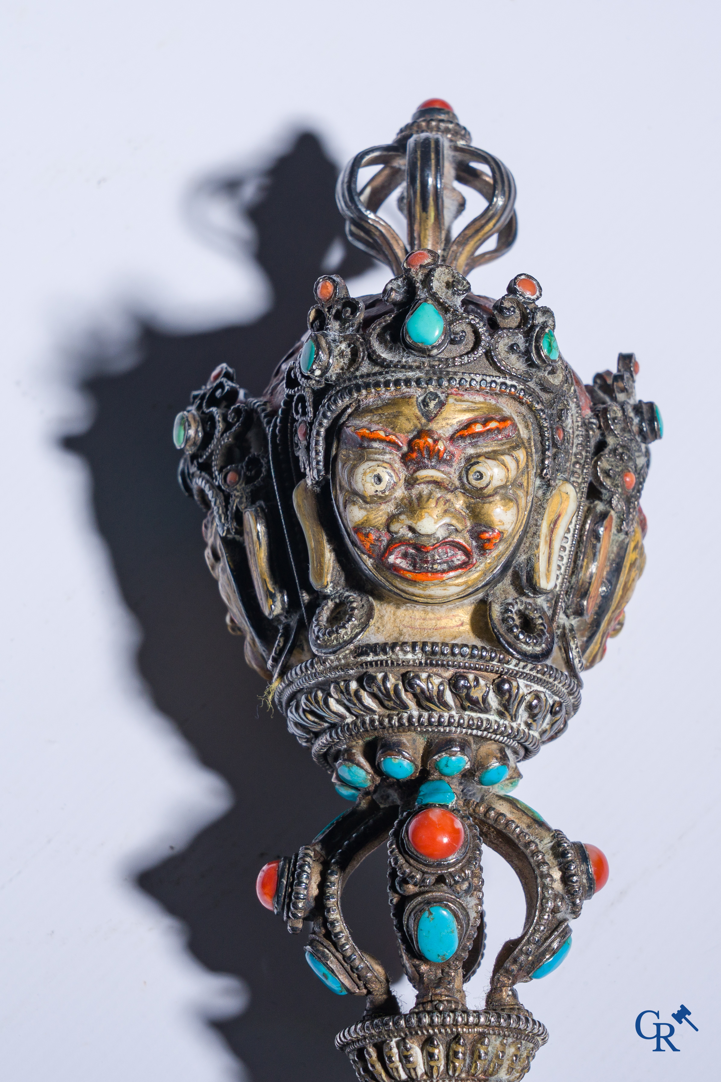 Asian Art, Phurba. Tibetan ritual dagger in silver, inlaid with turquoise and red coral.