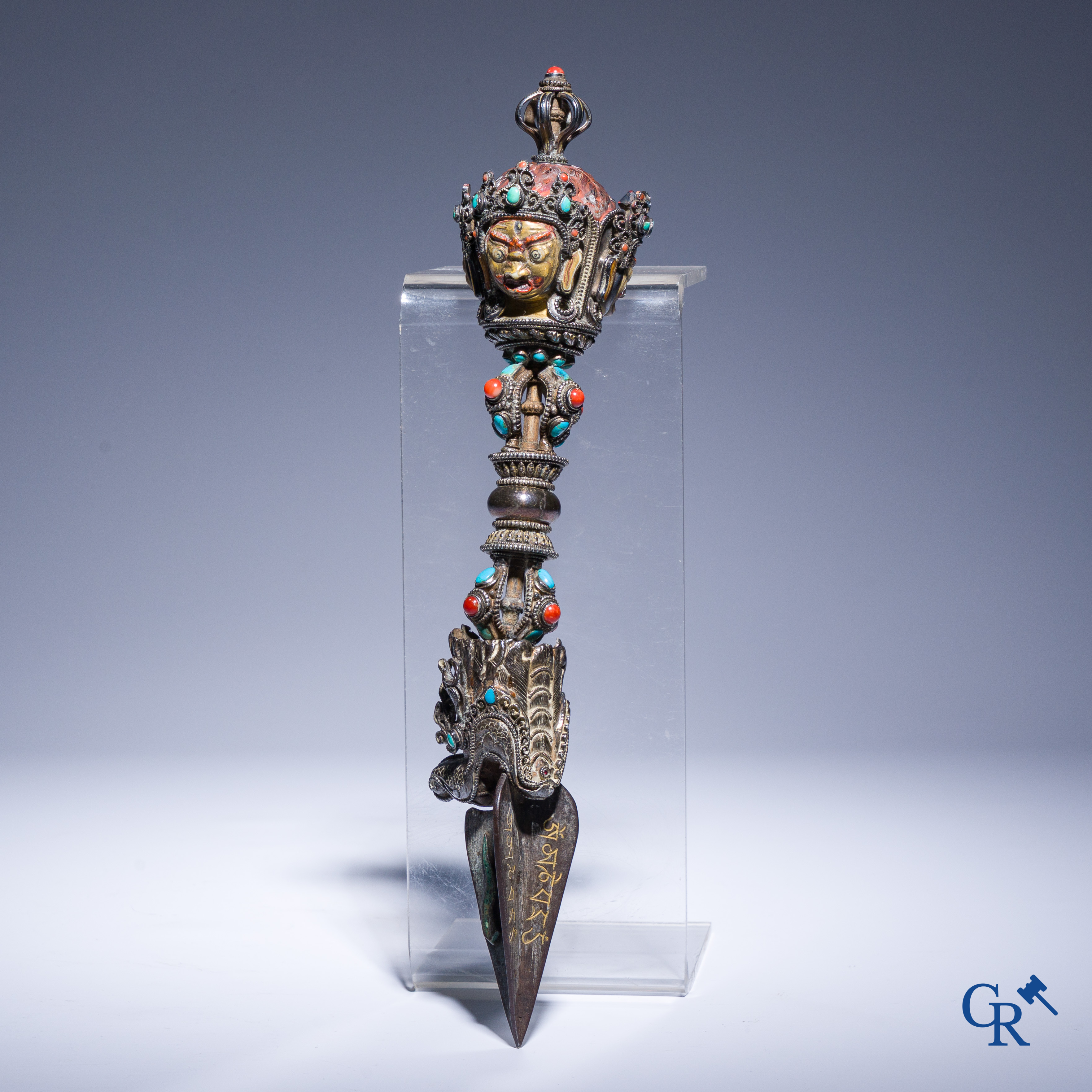 Asian Art, Phurba. Tibetan ritual dagger in silver, inlaid with turquoise and red coral.