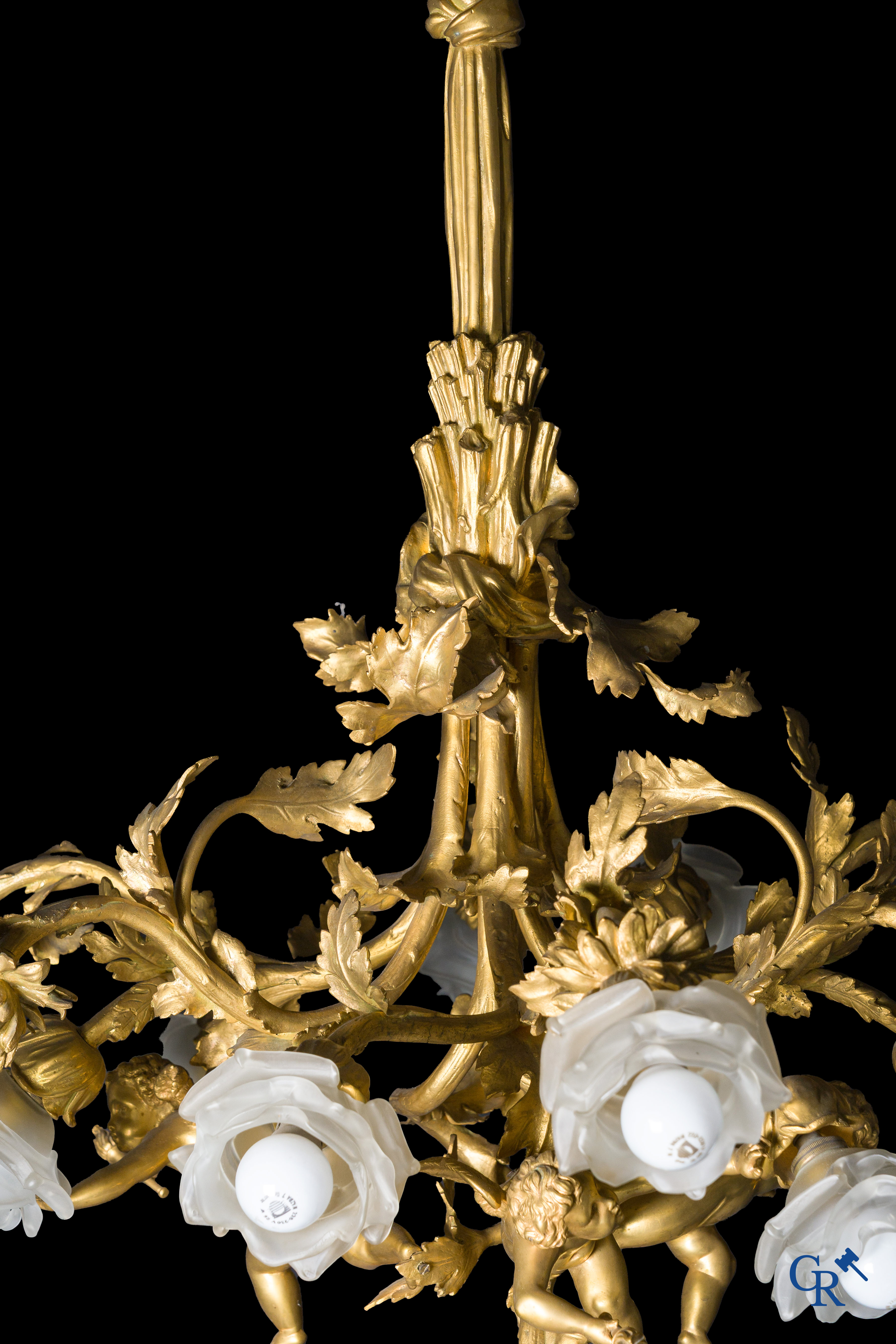 An imposing bronze gilded Napoleon III chandelier with 3 putti and 13 light points. LXVI style.