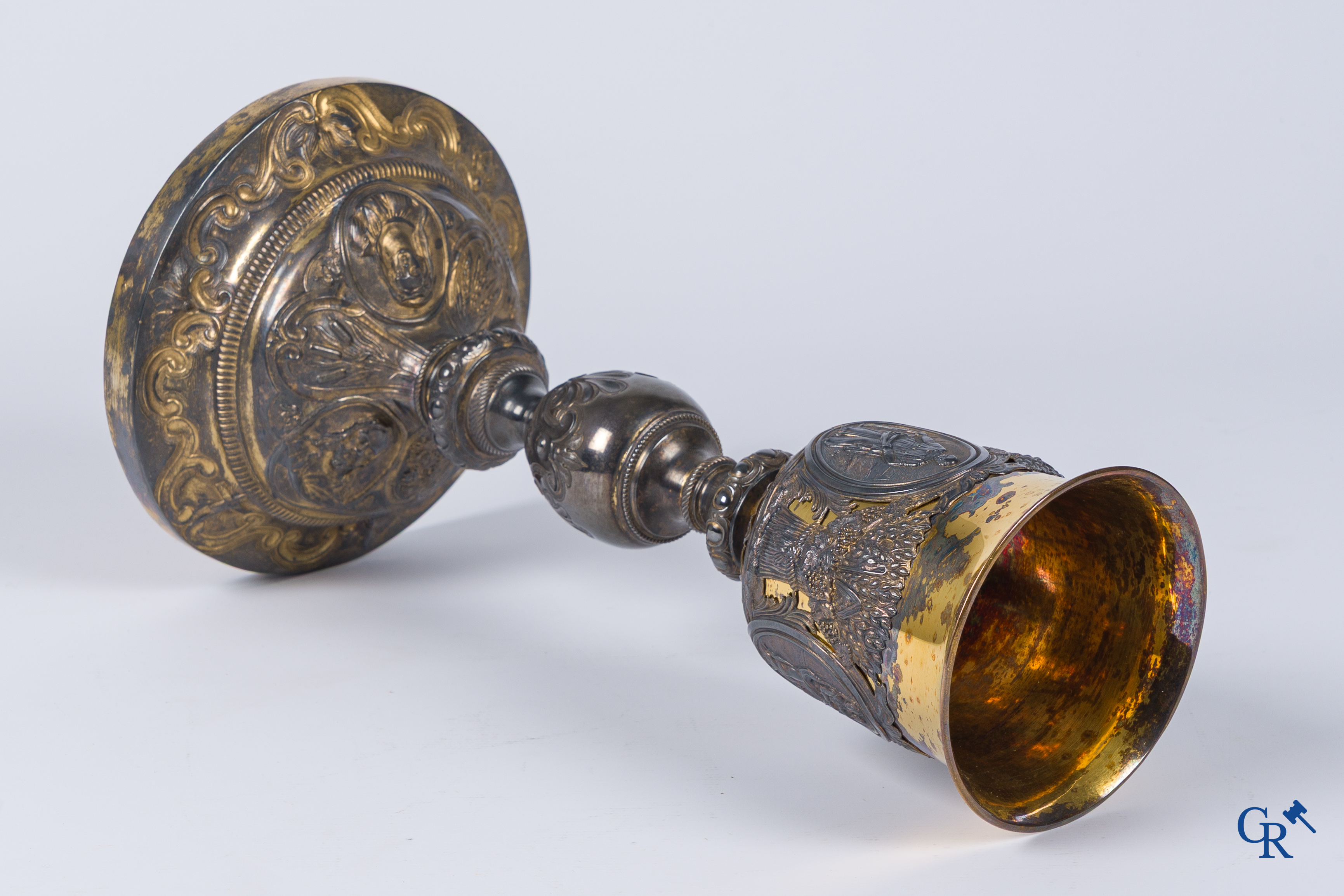 Martin & Dejean, orfèvres. A relief decorated chalice in silver and vermeil. Paris, 1st half of the 19th century.