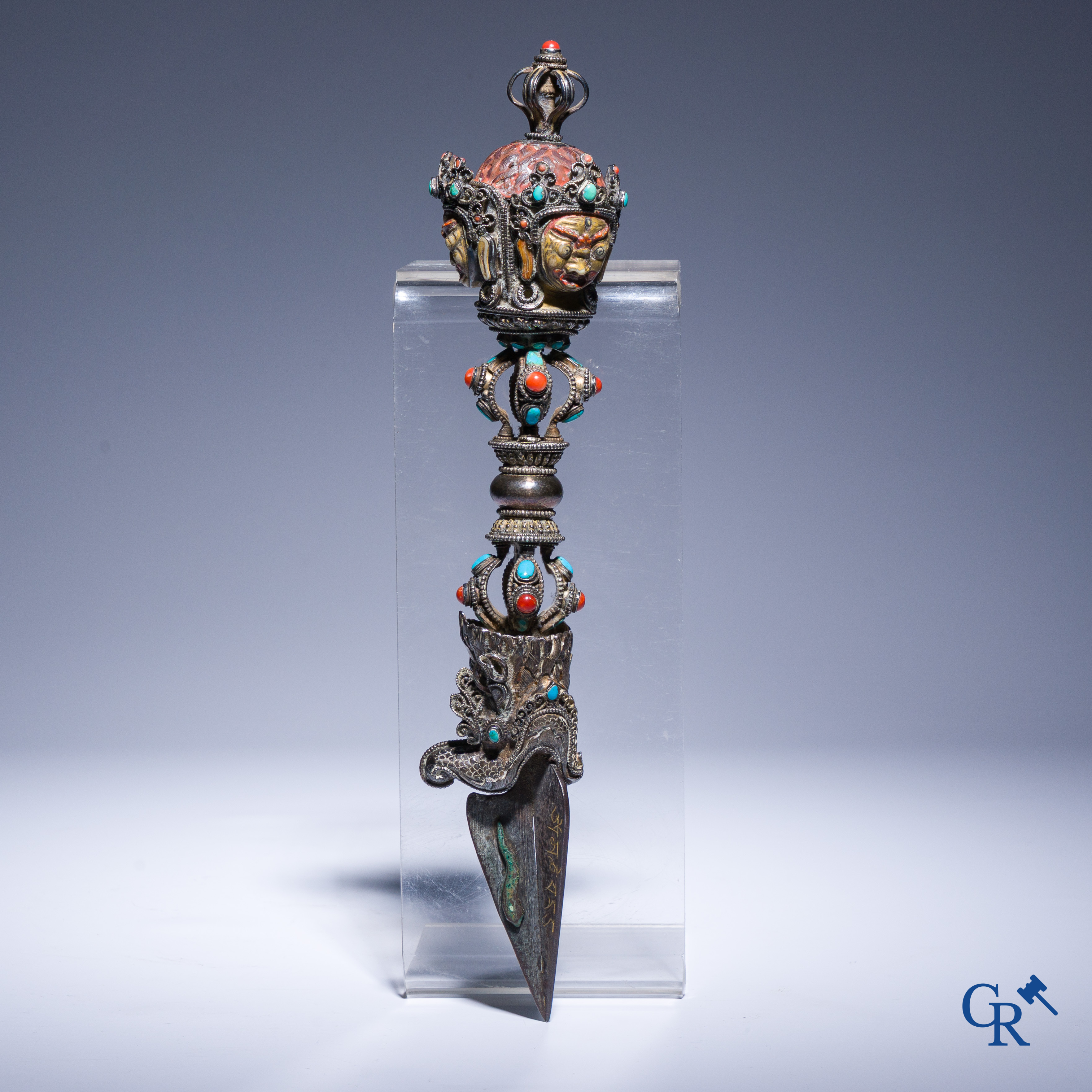 Asian Art, Phurba. Tibetan ritual dagger in silver, inlaid with turquoise and red coral.