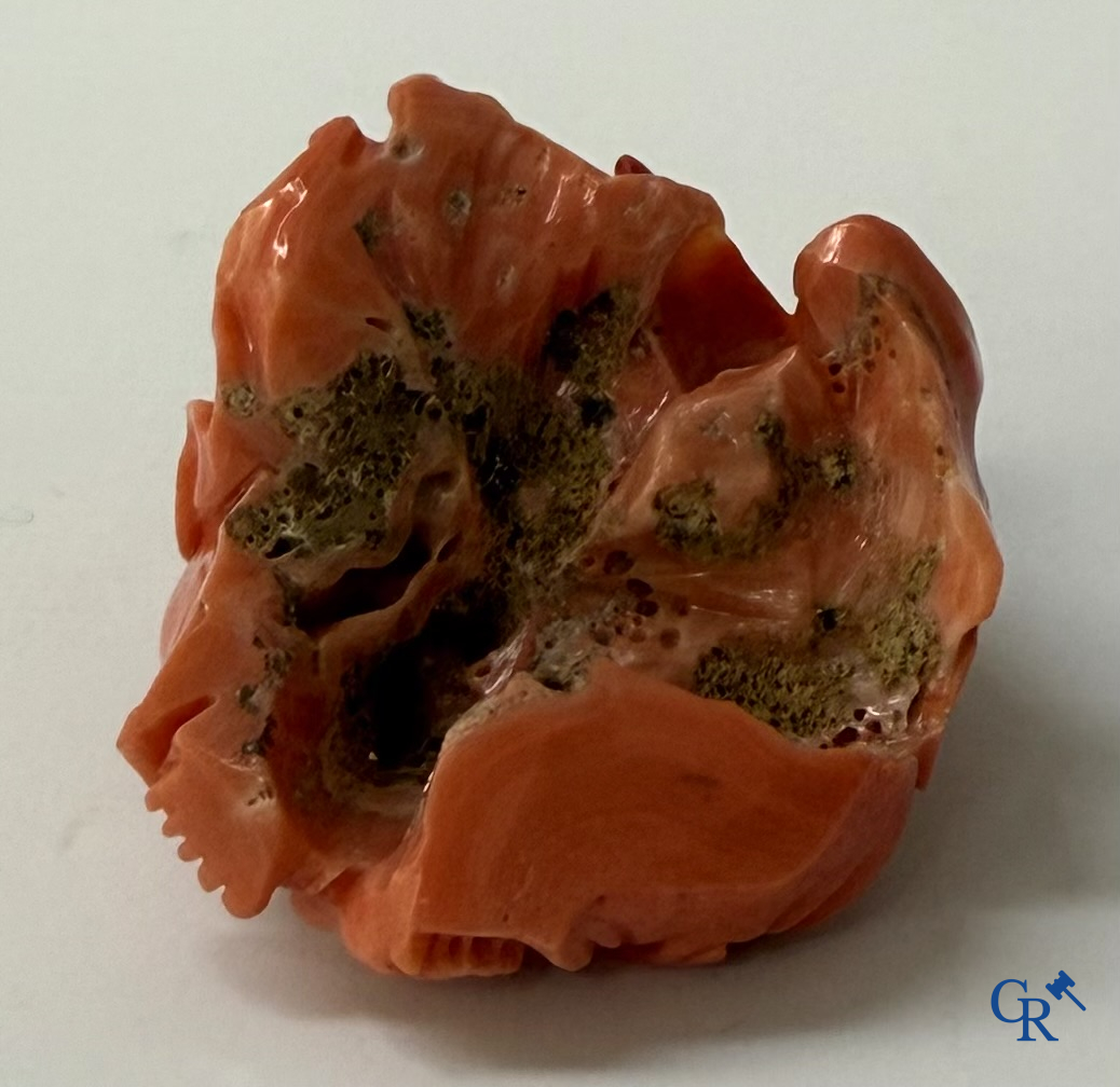 Asian Art, a Chinese carved red coral Buddha figure with child.