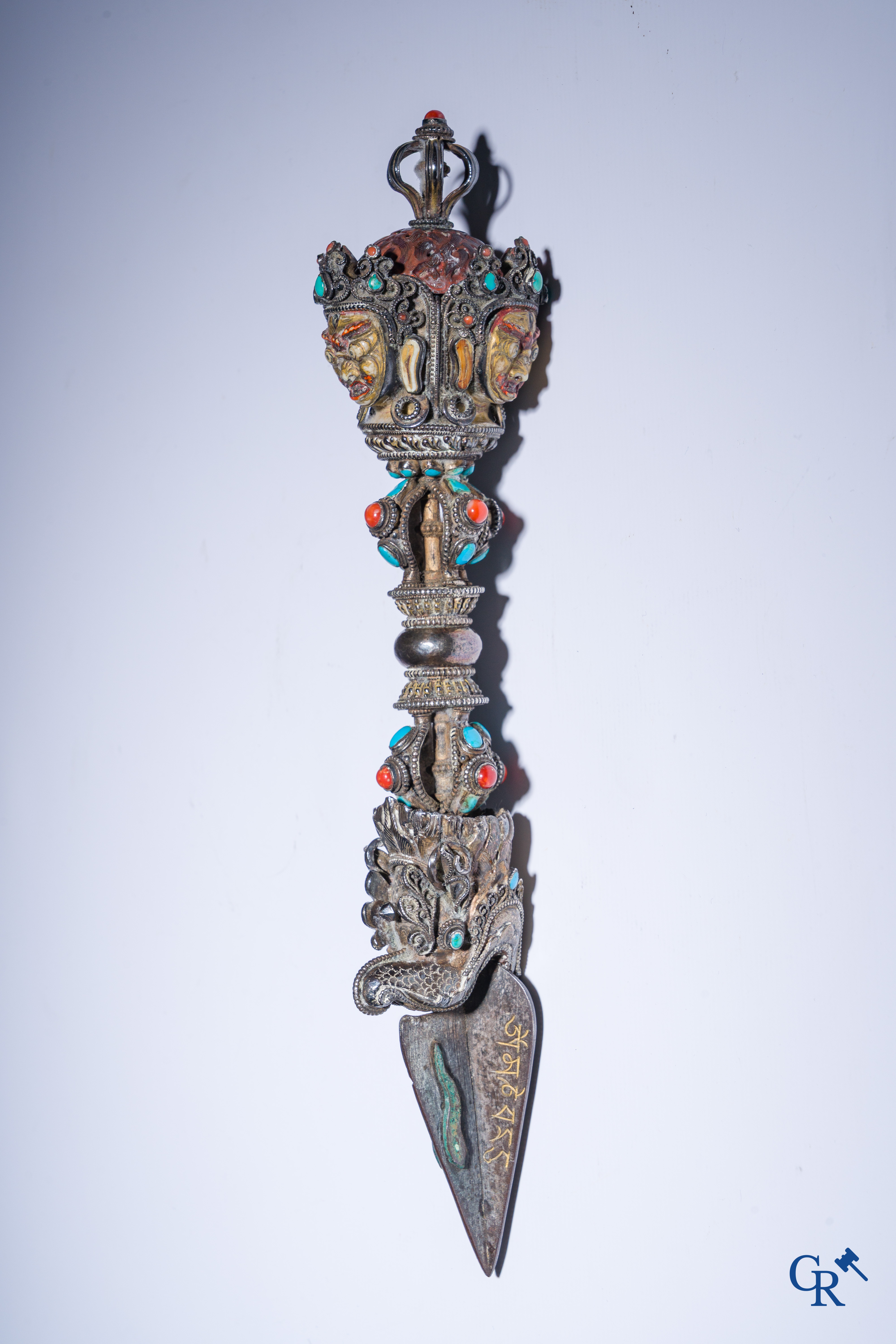 Asian Art, Phurba. Tibetan ritual dagger in silver, inlaid with turquoise and red coral.