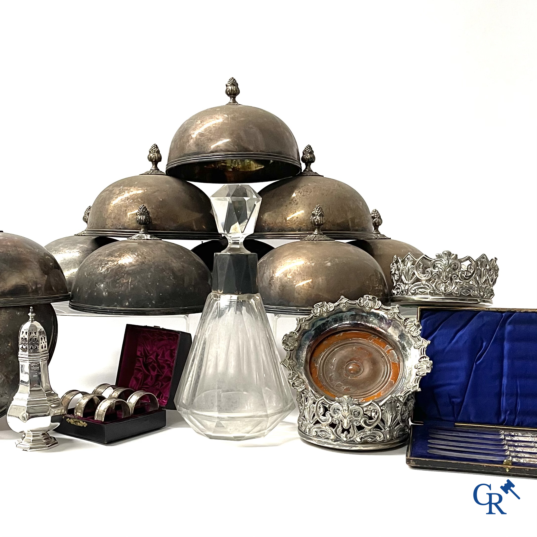 A set of 10 silver-plated metal table bells, a carafe with silver frame, silver napkin rings, a sprinkler bus, etc.