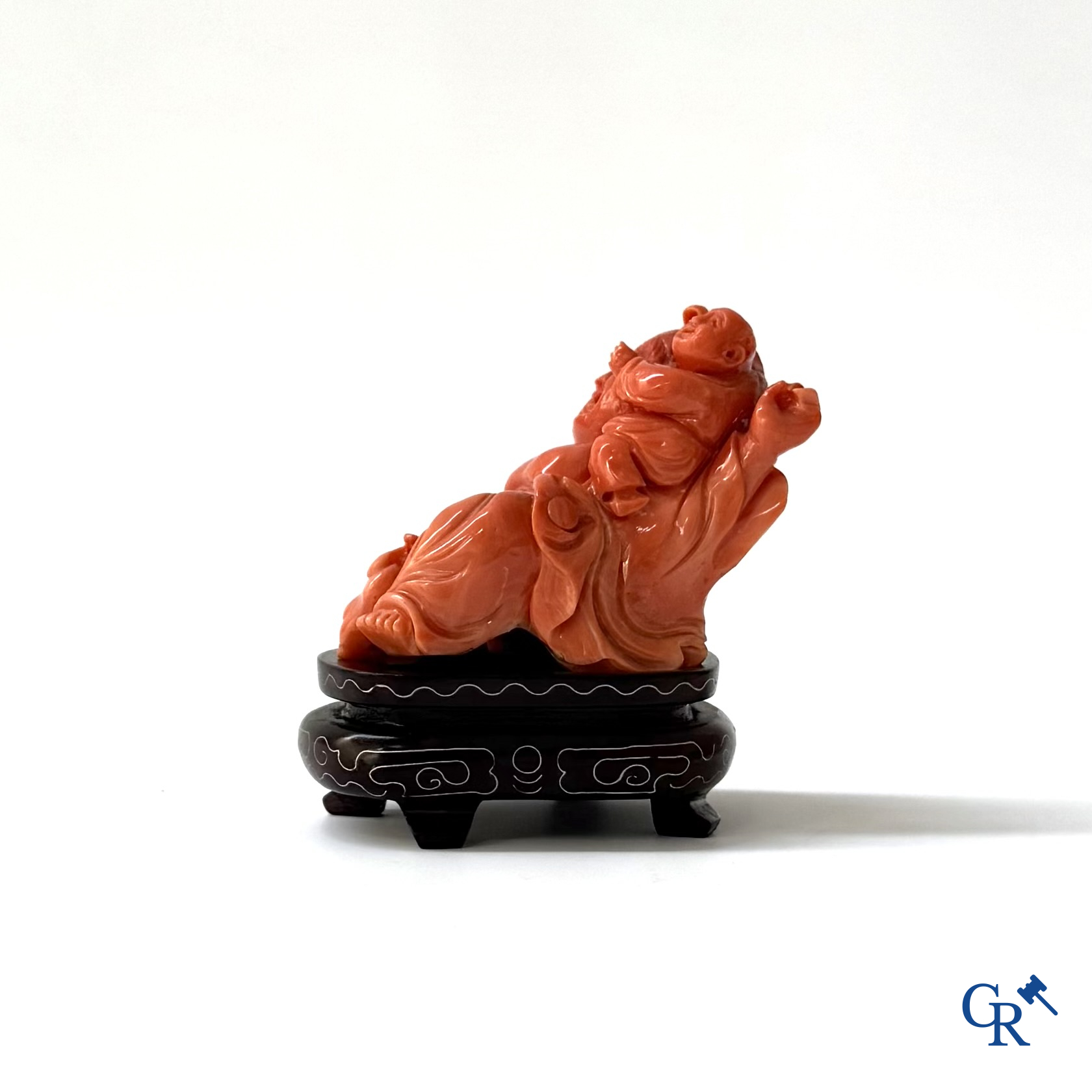 Asian Art, a Chinese carved red coral Buddha figure with child.