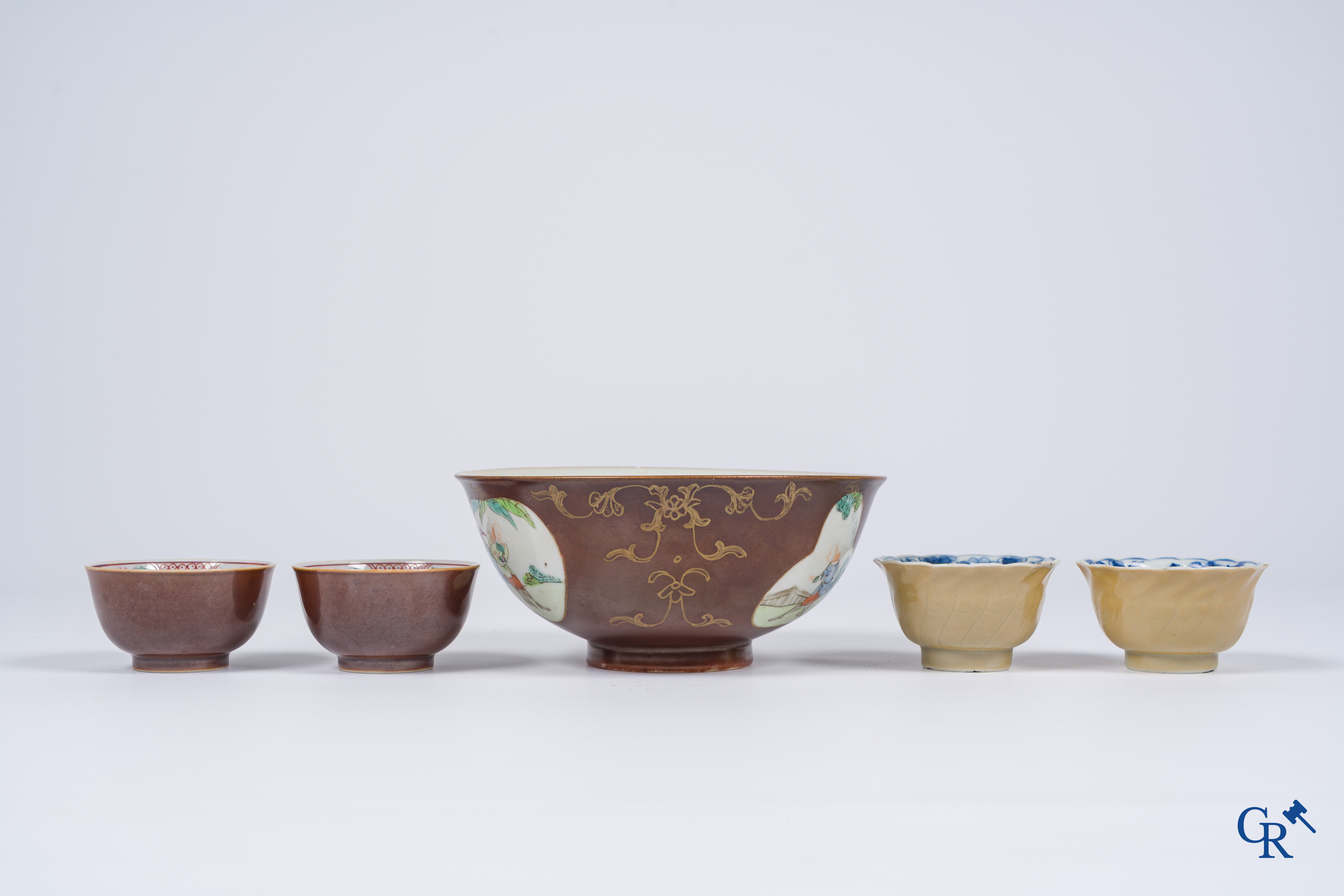 Asian Art, Chinese porcelain. A large Chinese "café au lait" bowl and saucer. 4 cups with saucers attached.