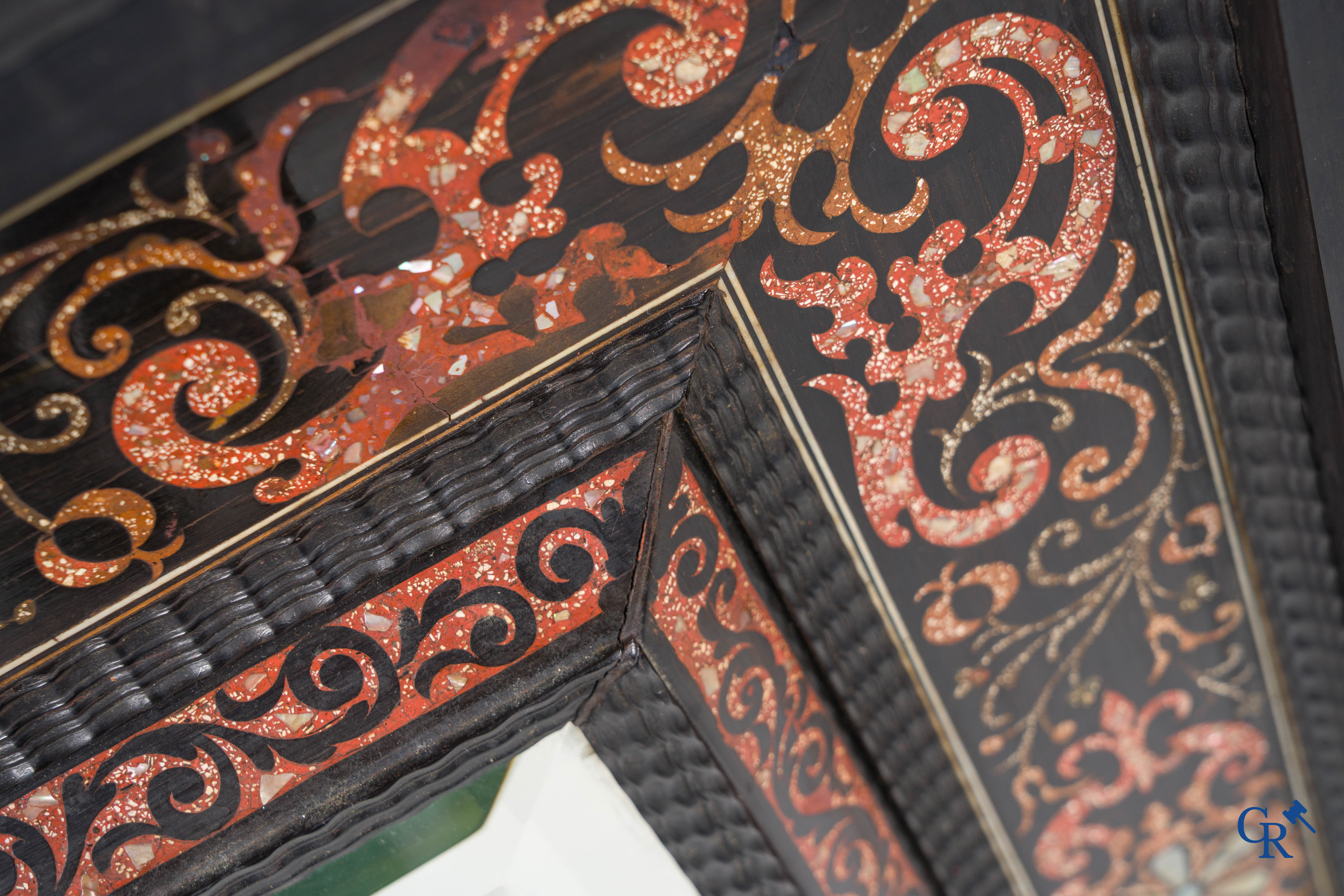 A mirror in ebony and inlay. 18th- 19th century.