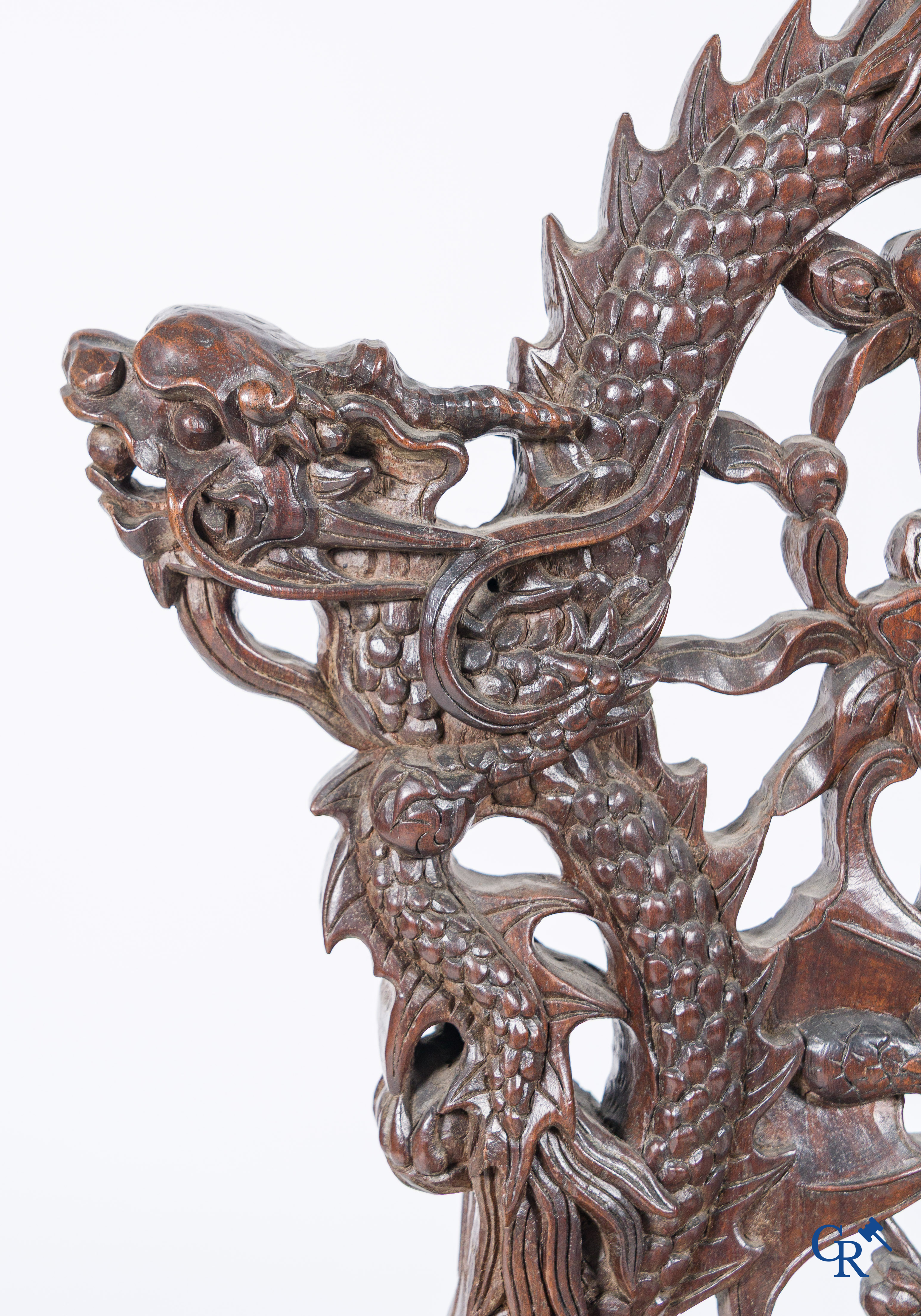 Asian Art, A pair of richly carved chairs with bats, dragons and flowers in Chinese hardwood. 19th century.