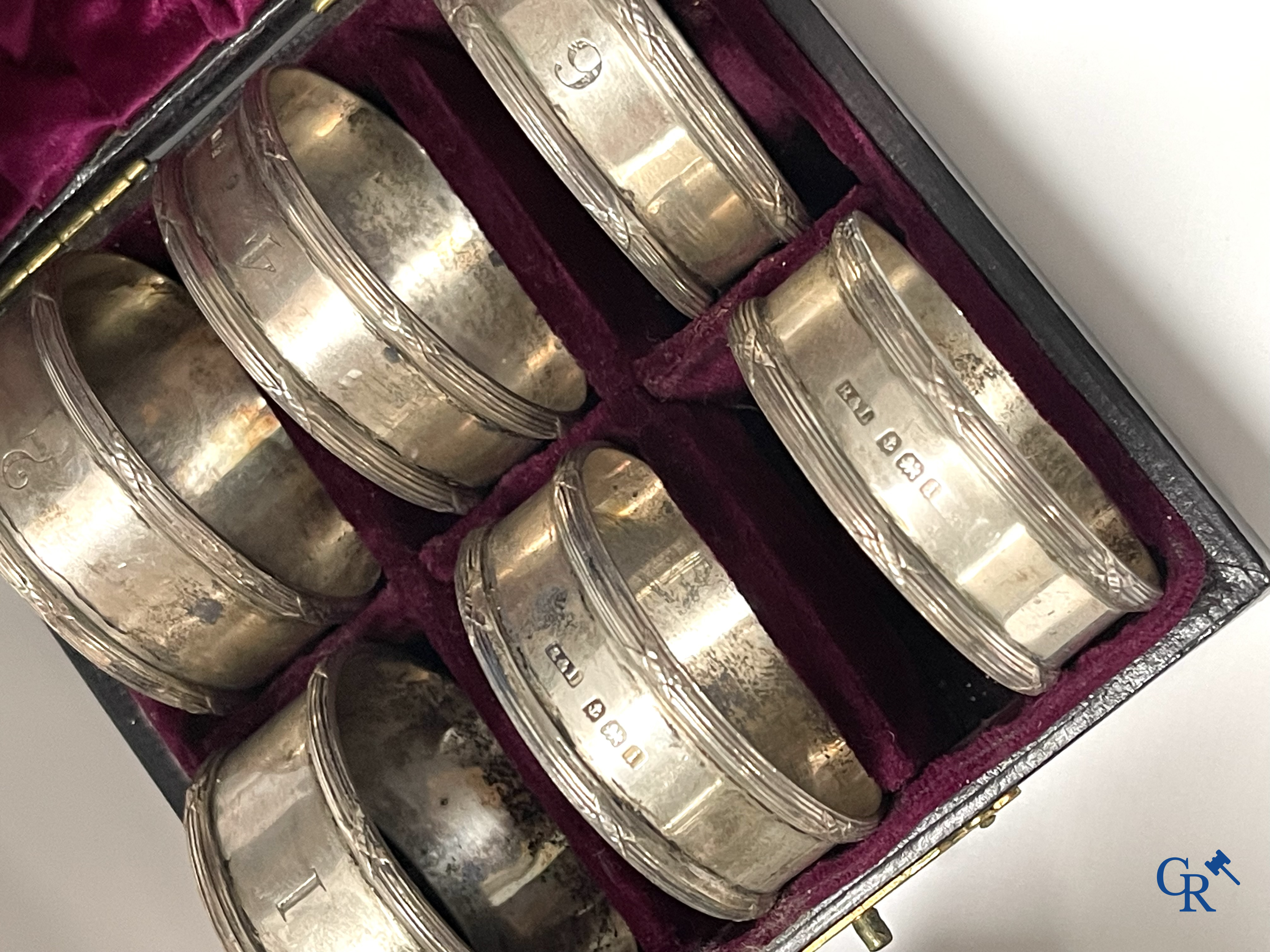 A set of 10 silver-plated metal table bells, a carafe with silver frame, silver napkin rings, a sprinkler bus, etc.