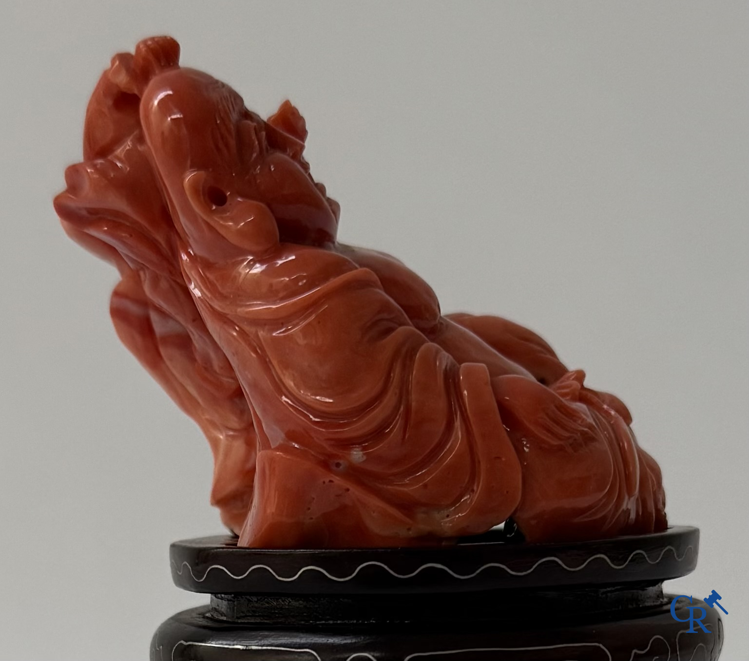 Asian Art, a Chinese carved red coral Buddha figure with child.