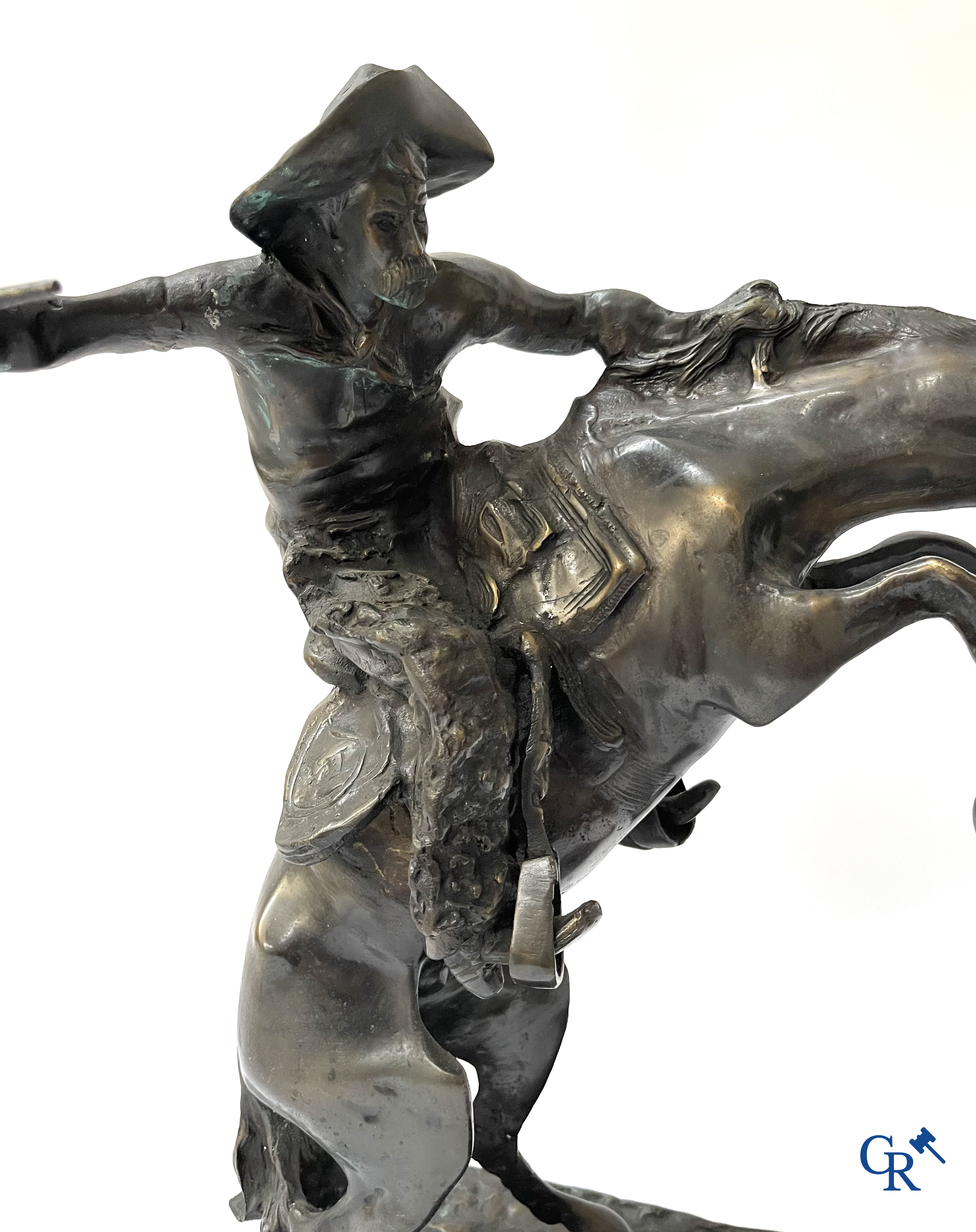 Frederic Remington (after) The bronco buster. Bronze on a green veined marble base. Posthumous. 20th century.