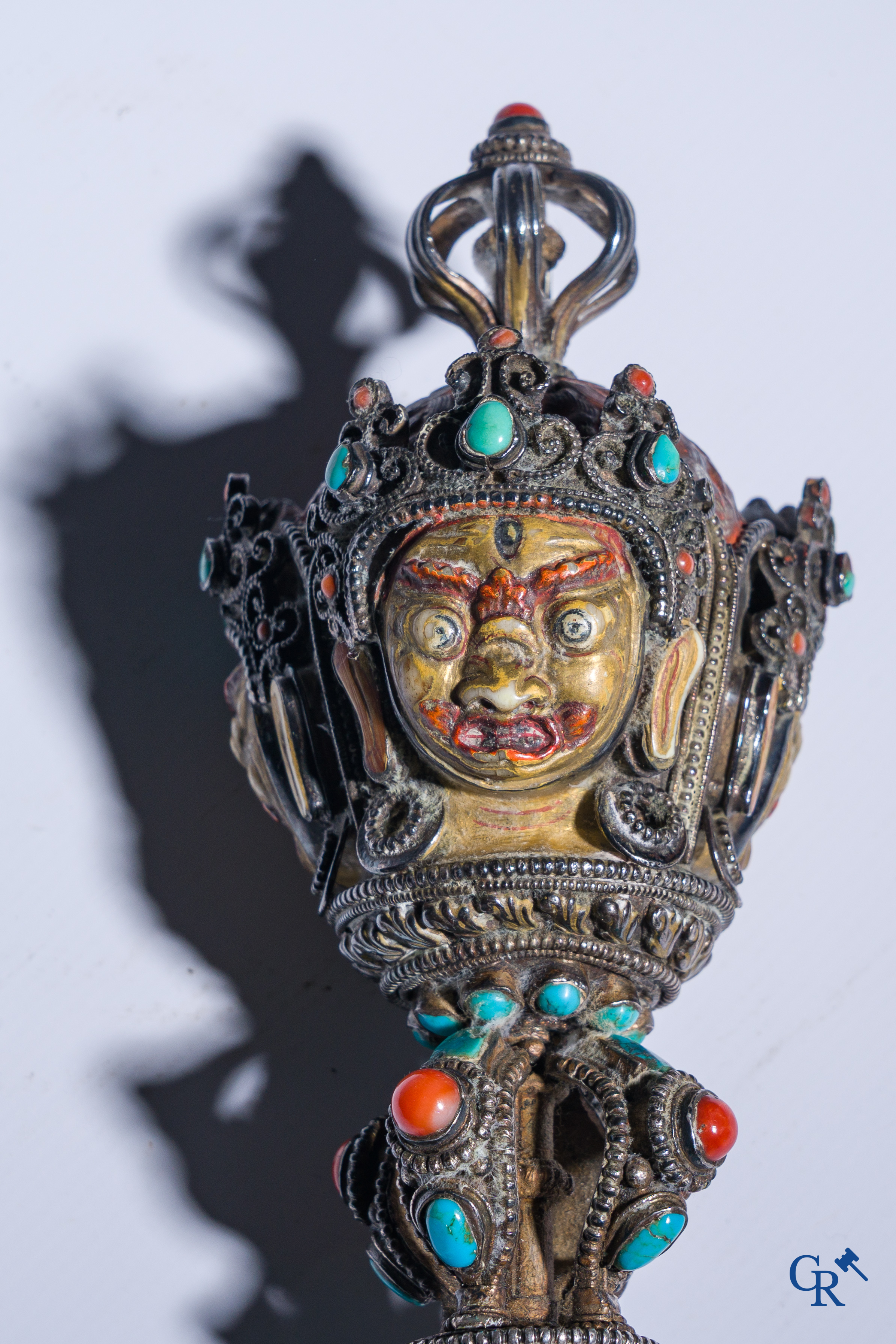 Asian Art, Phurba. Tibetan ritual dagger in silver, inlaid with turquoise and red coral.